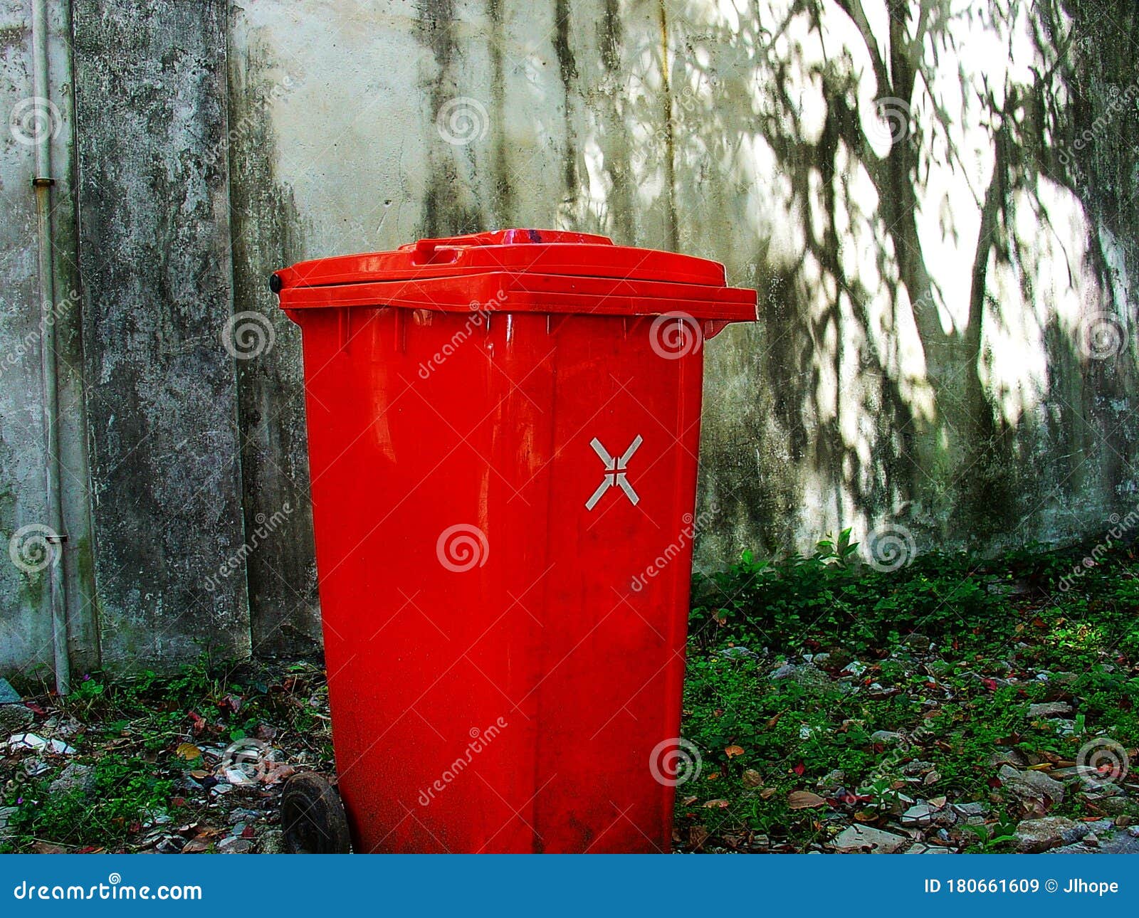 Red Garbage Can Against Wall Stock Image Image of recycle, wall