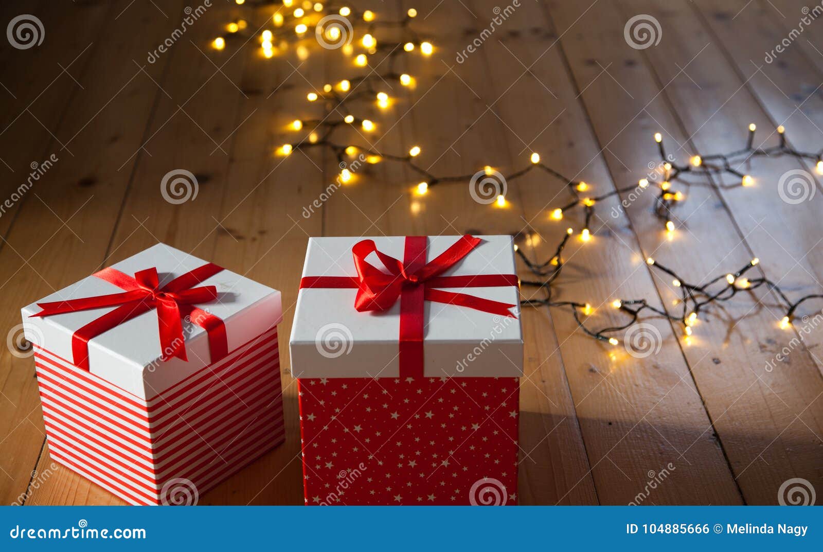 Gift Boxes and Christmas Lights on Wooden Floor Stock Photo Image of