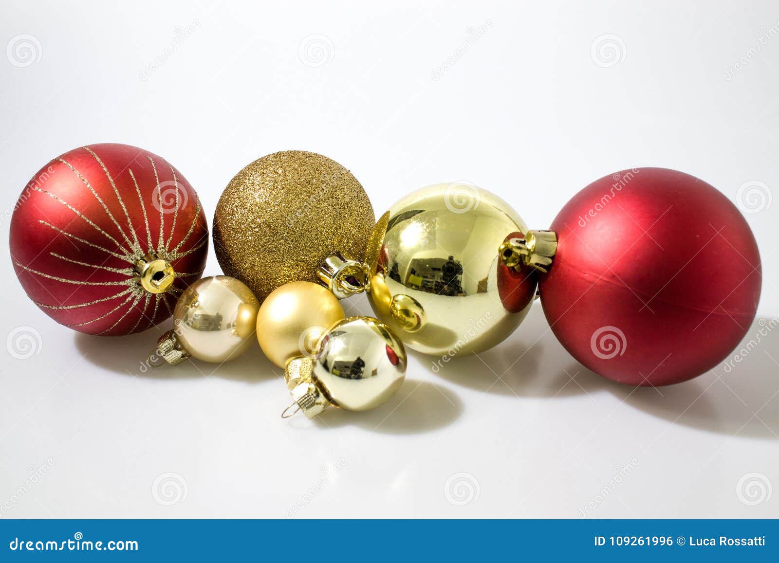 Red And Gold Christmas Balls Decorations In A White Background Stock ...