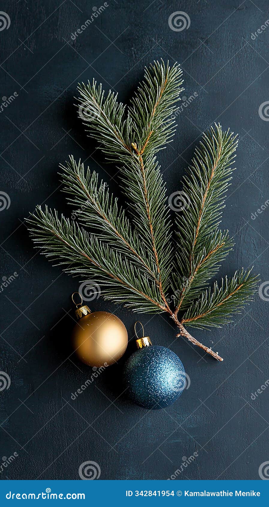 red and gold ornaments on a frosted evergreen branch