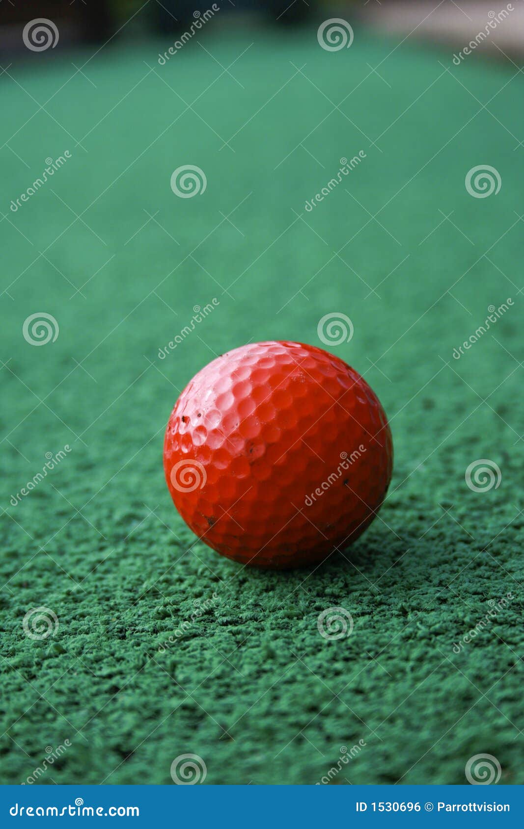 Red Golfball on the Green stock photo. Image of synthetic 1530696