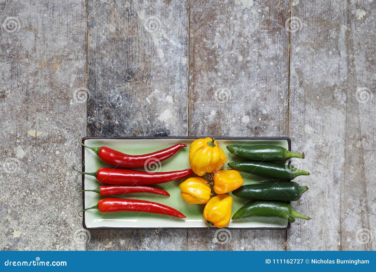 Red Green And Yellow Hot Peppers Arranged On Tray Stock Image Image Of Mexican Jalapeno 111162727