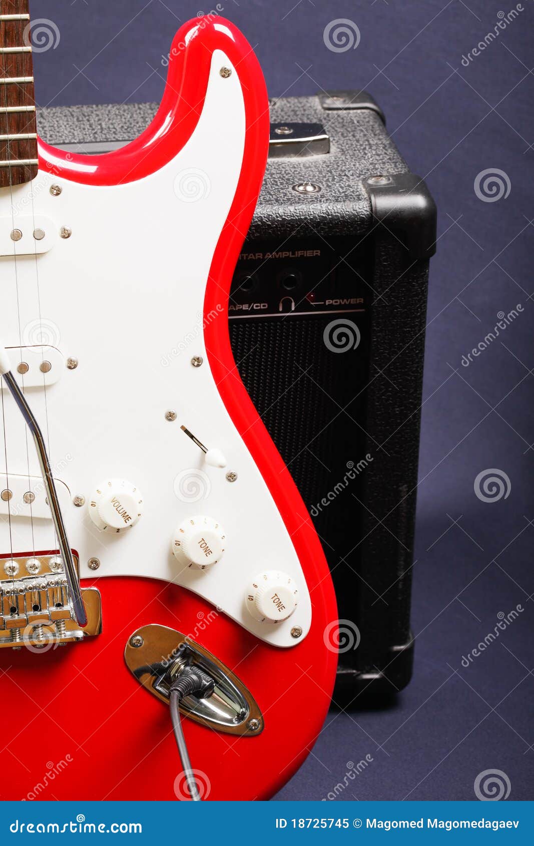 Red guitar on amplifier stock image. Image of instrument 18725745