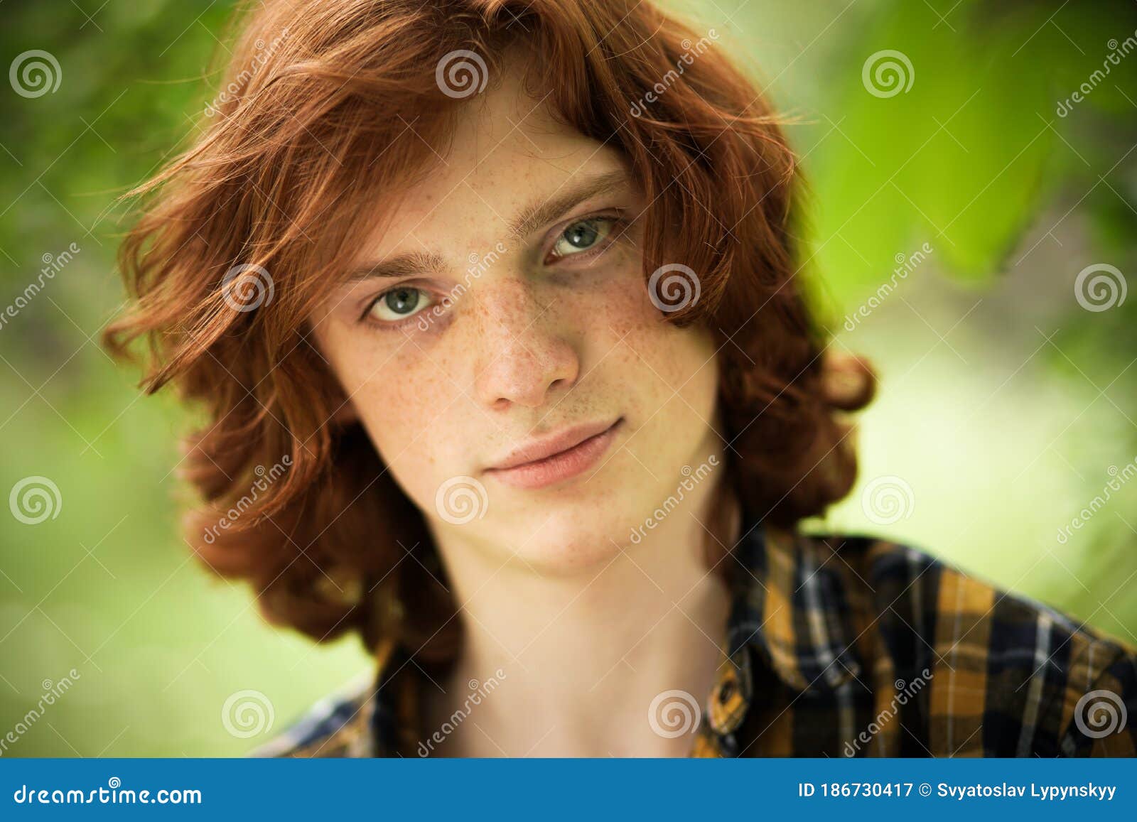 Red-haired Freckled Man Posing in Sunny Day Outdoors. Young Foxy Green-eyed  Handsome Stands on Green Floral Blurred Stock Image - Image of mysterious,  handsome: 186730417