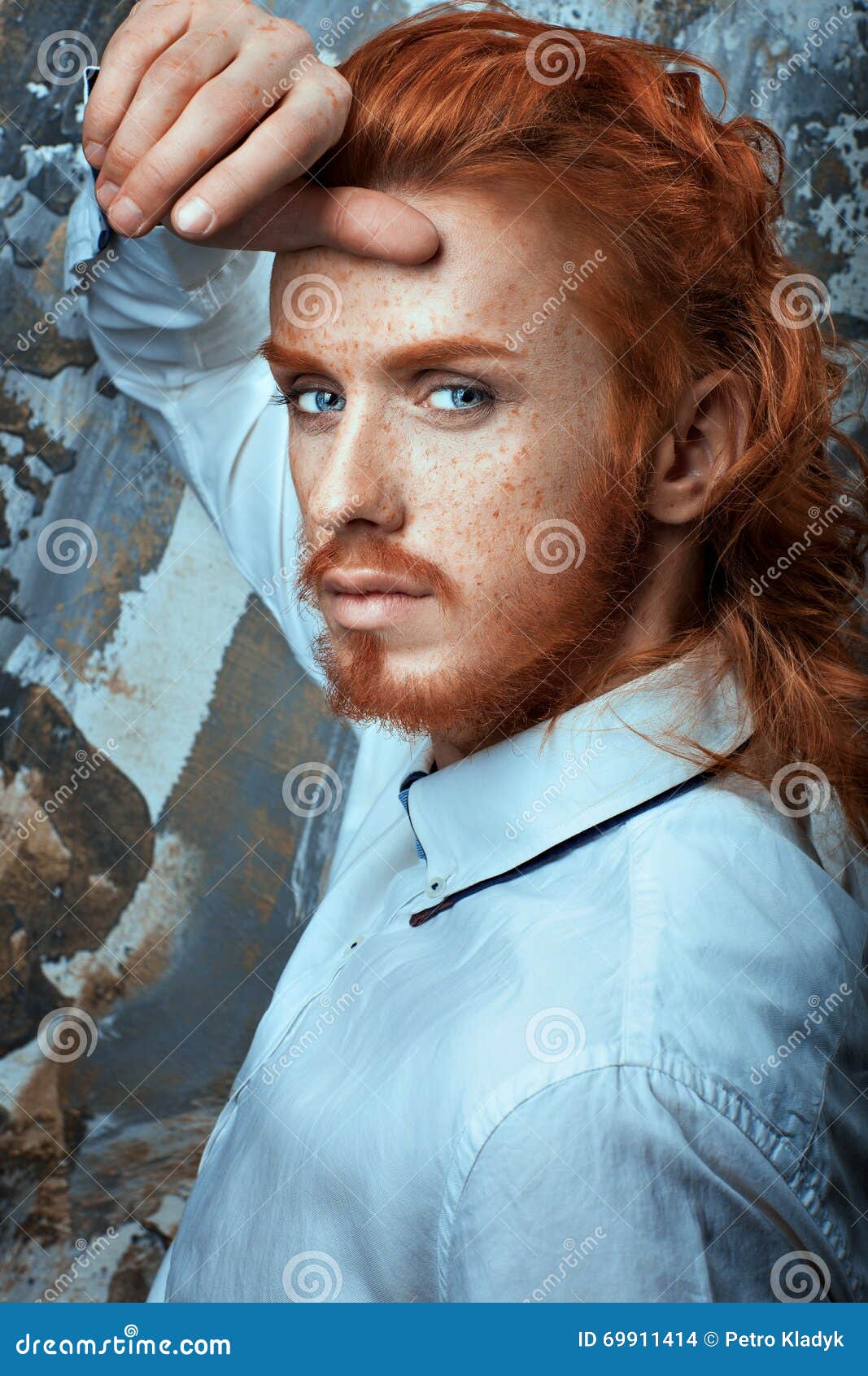 red-haired man in white shirt metrosexual.