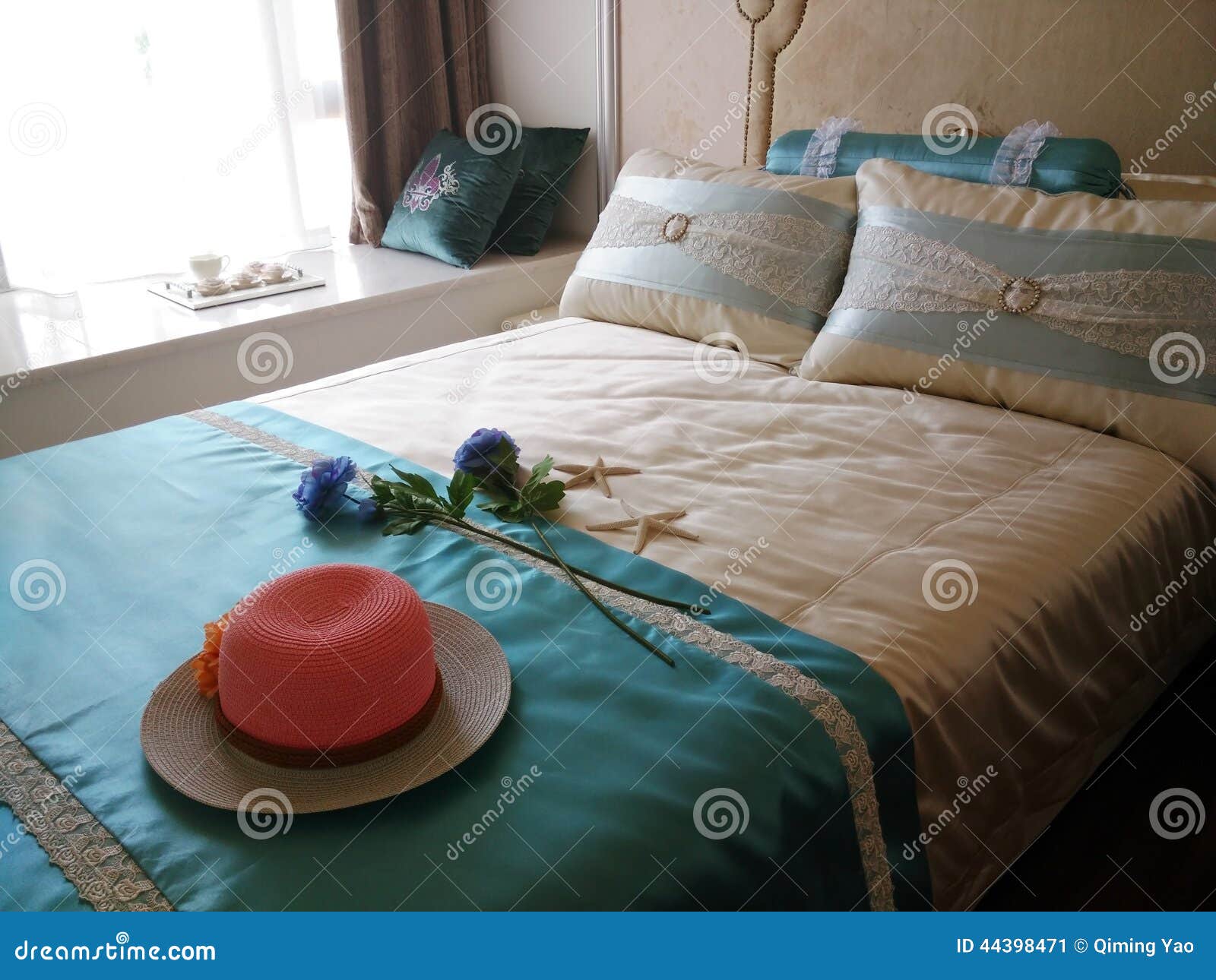 Red hat on the bed stock image. Image of pillows, model 44398471