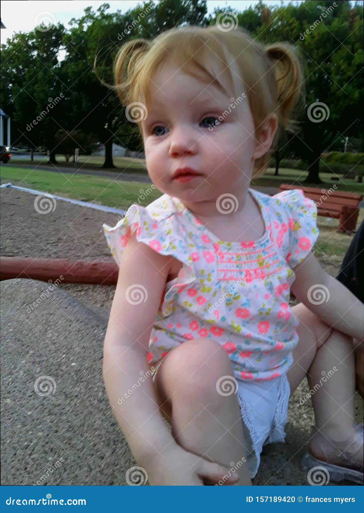 Red Headed Little Girl Sitting in Rocks Stock Photo - Image of head ...