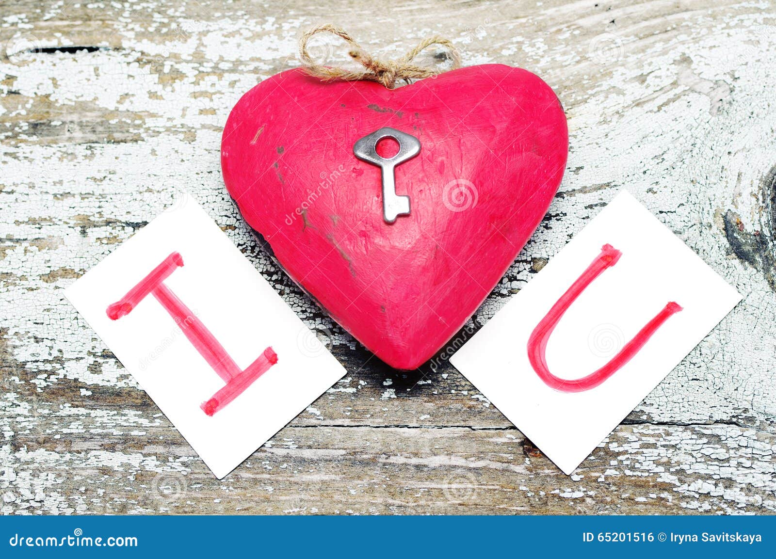 Red Heart with a Small Metal Key and Card Text I LOVE YOU . Stock Photo