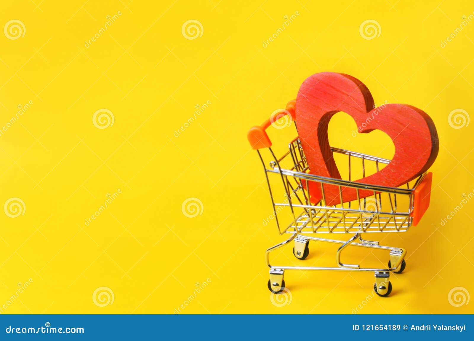 Red Heart In The Supermarket Trolley. Concept Of Buying Love. Valentine