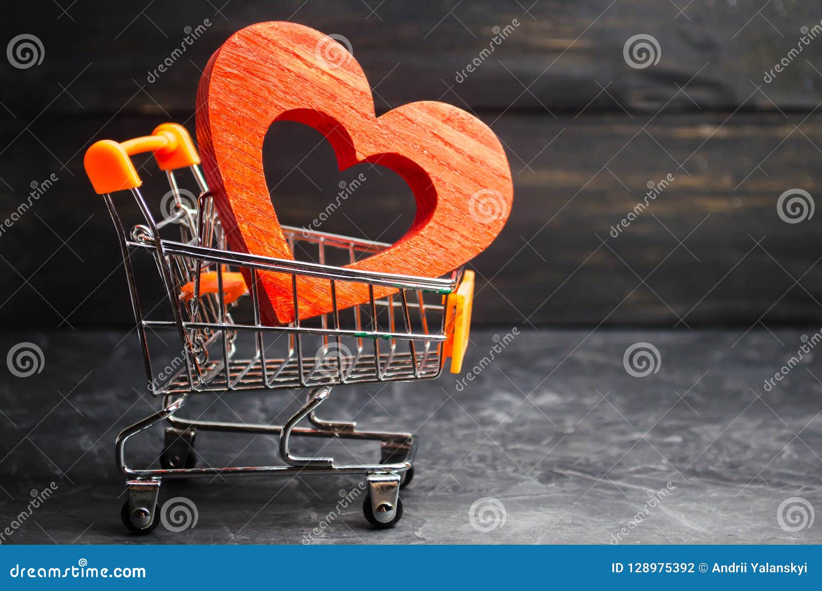Red Heart in the Supermarket Trolley. Concept of Buying Love. Valentine
