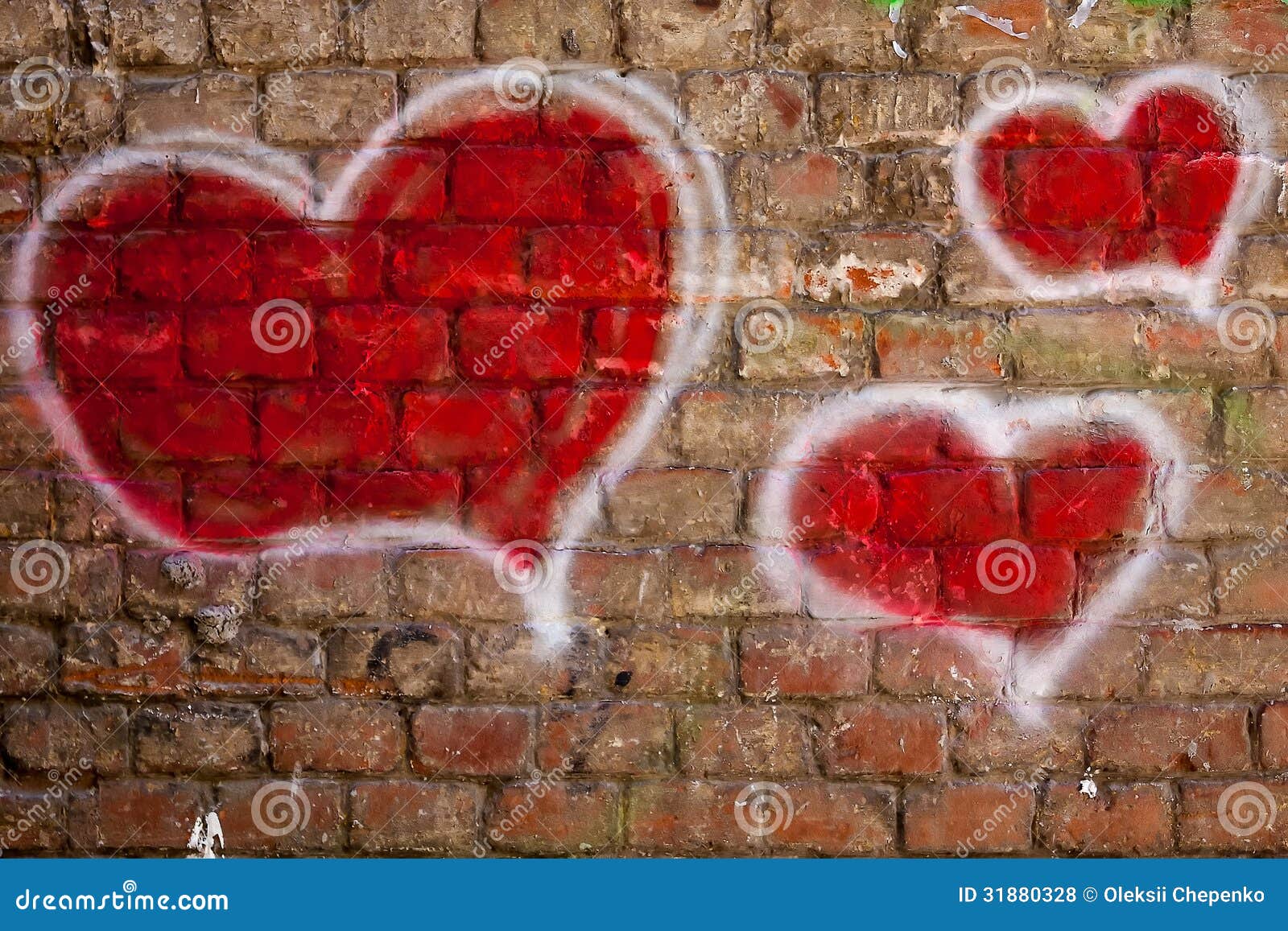red hearts painted on a brick wall