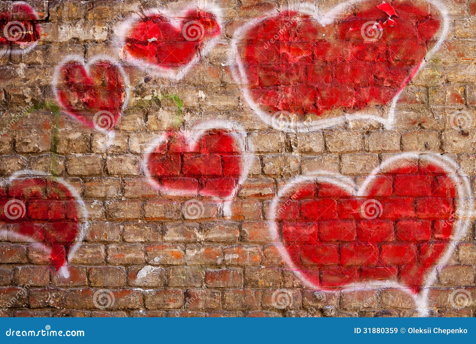 red hearts painted on a brick wall