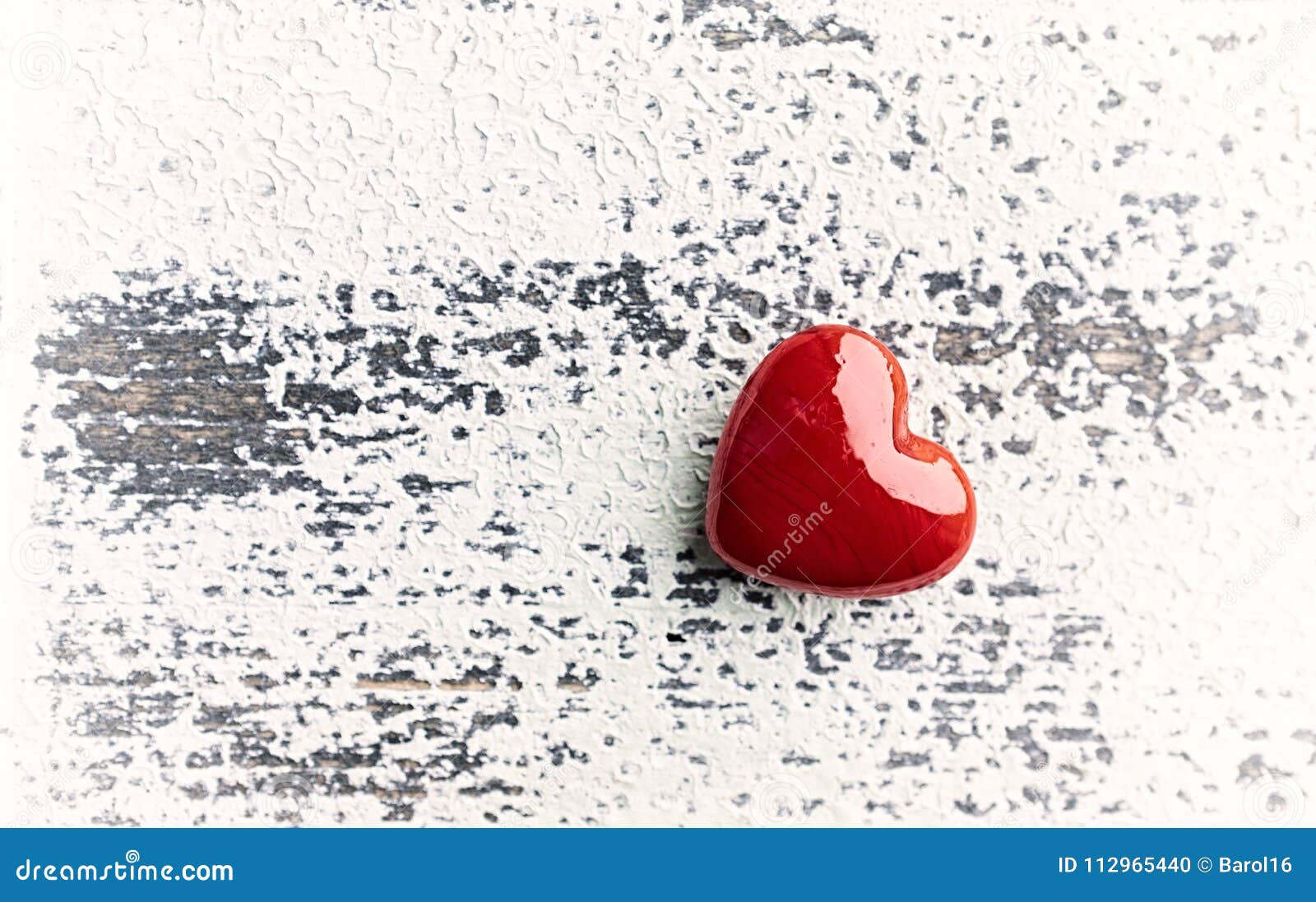 red hert on rustic wooden background