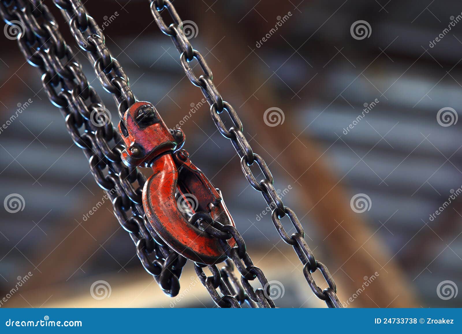 red hoist and chain on background