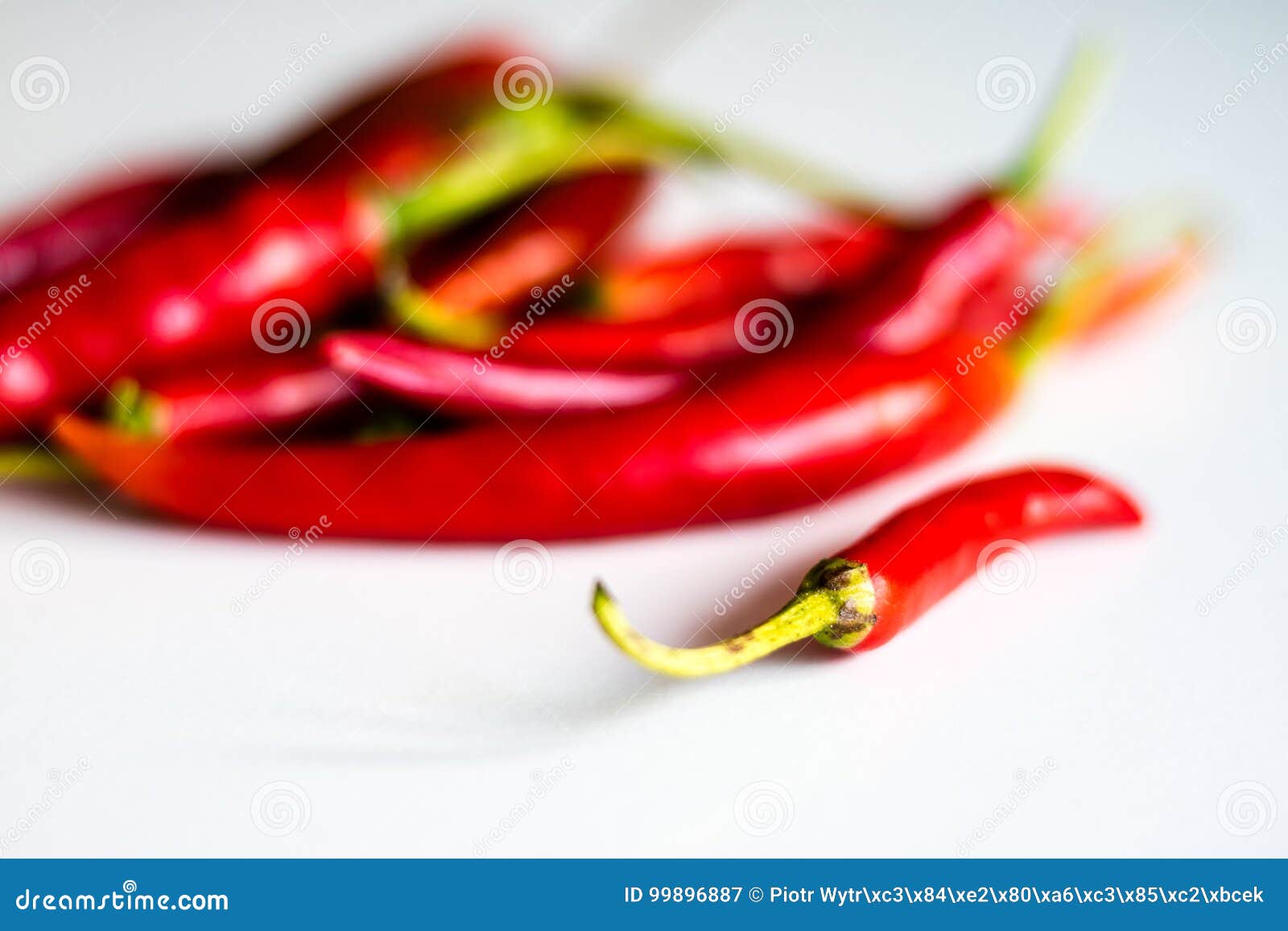 Red Hot Peppers Fresh On The Kitchen Table White Background