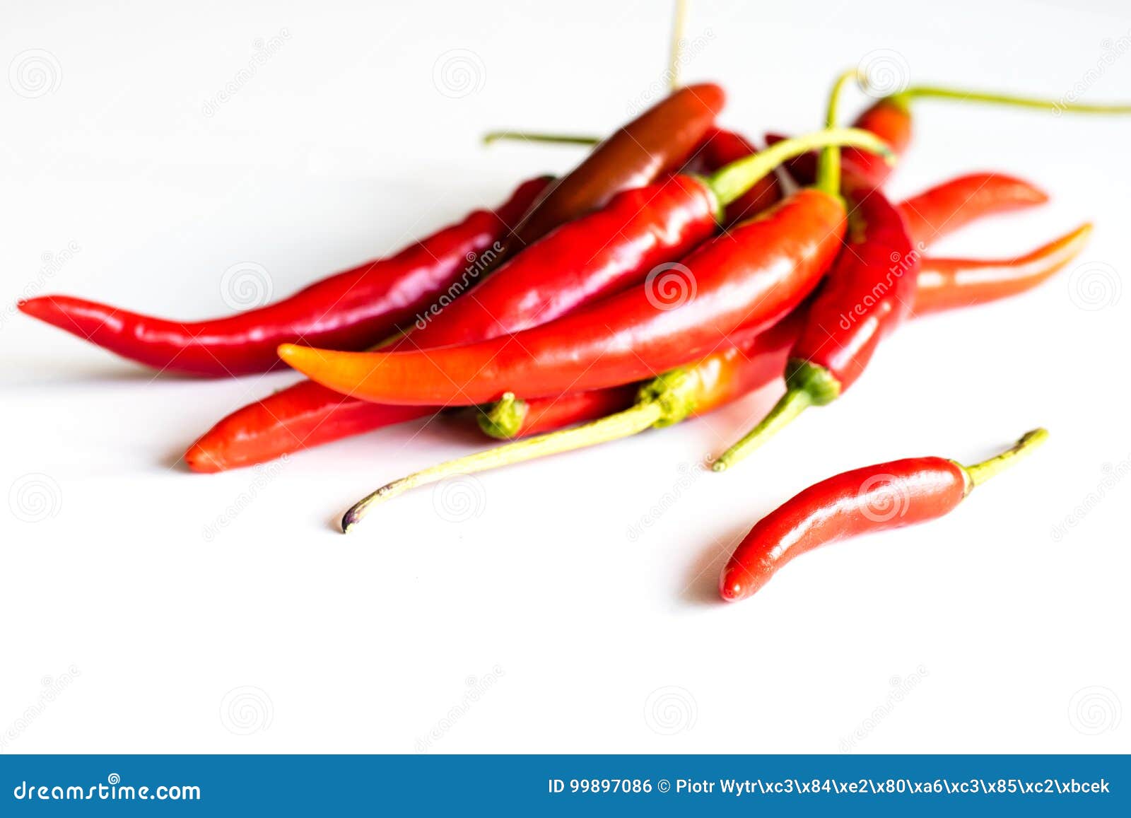 Red Hot Peppers Fresh On The Kitchen Table White Background