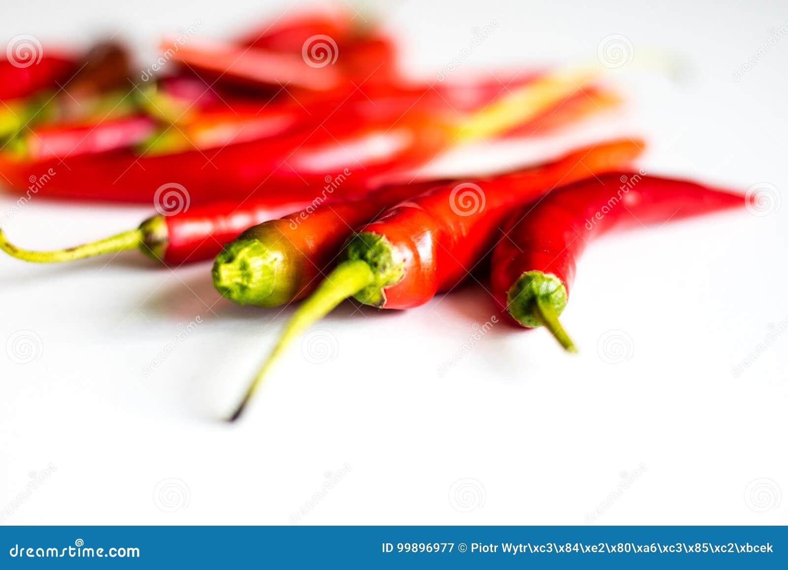 Red Hot Peppers Fresh On The Kitchen Table White Background