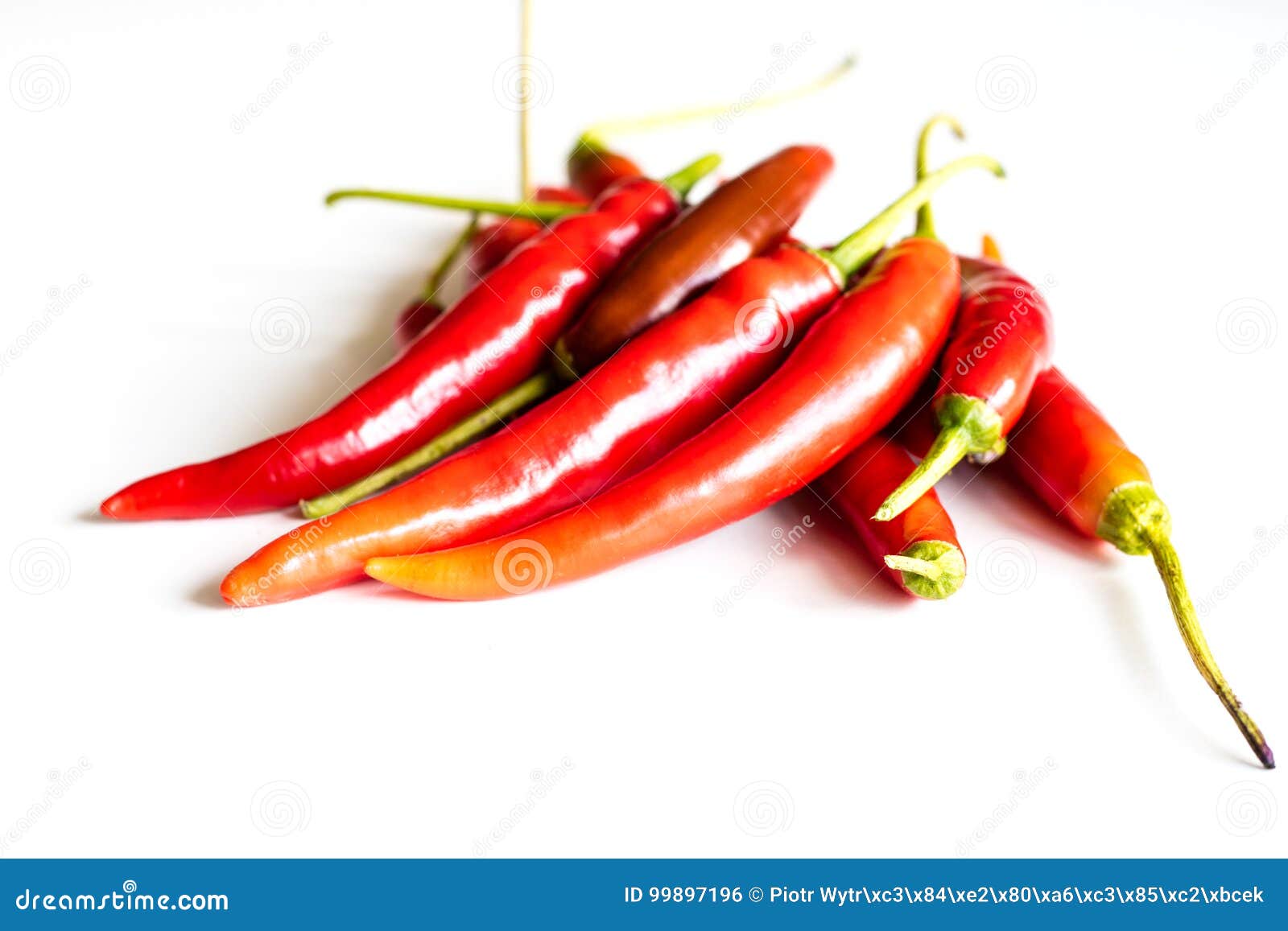 Red Hot Peppers Fresh On The Kitchen Table White Background