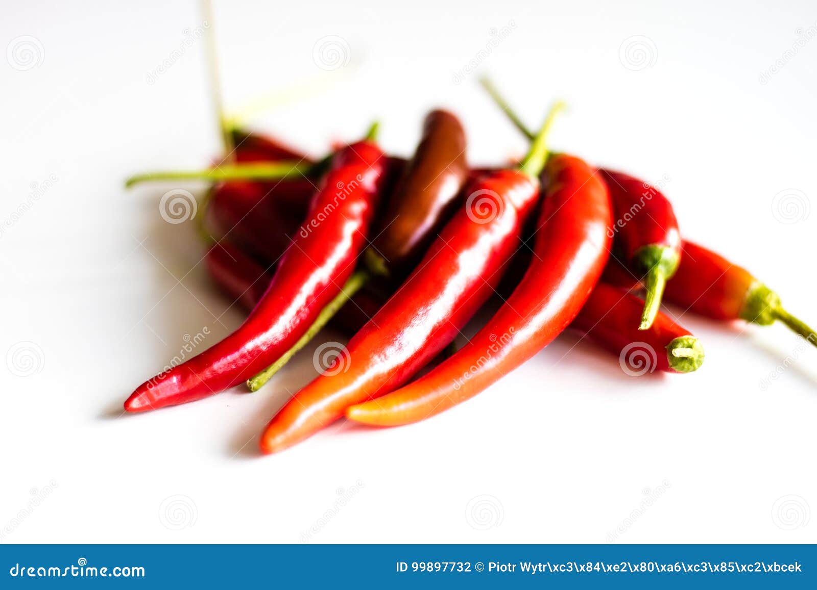 Red Hot Peppers Fresh On The Kitchen Table White Background