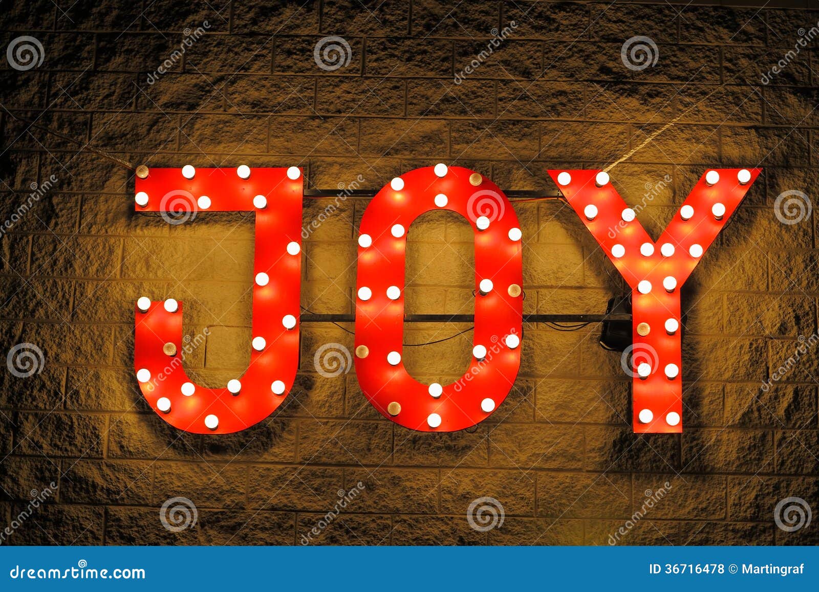 red illuminated sign joy