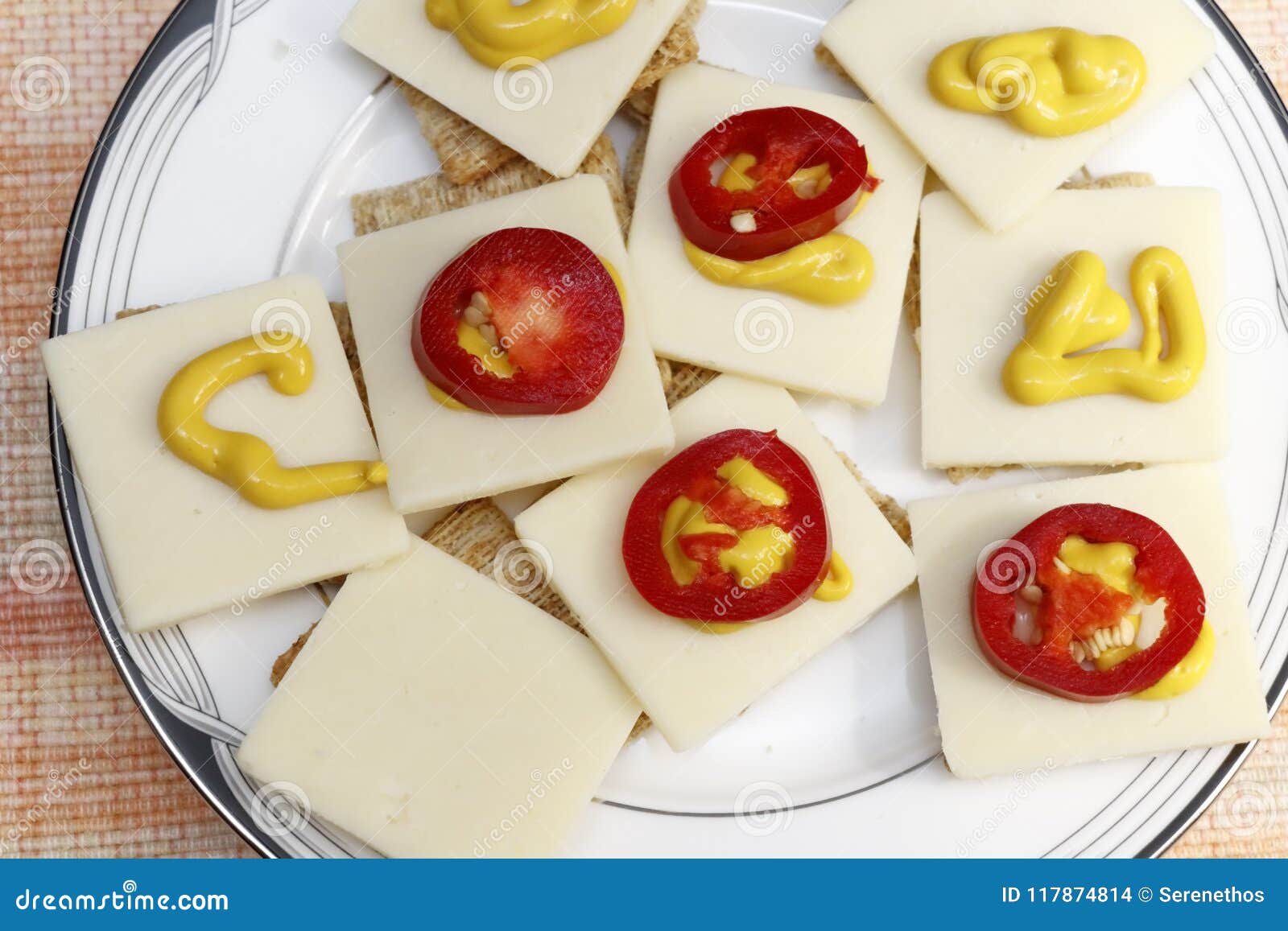 Red Jalapenos, Cheddar Cheese, Mustard on Crackers Stock Photo Image