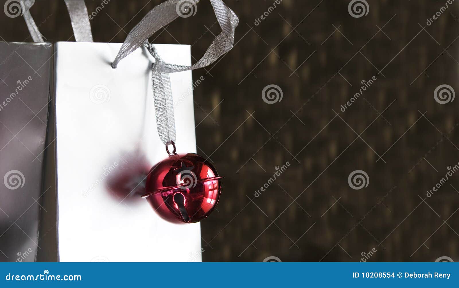 Red Jingle Bell on Silver Shopping Bag Stock Photo Image of shopping