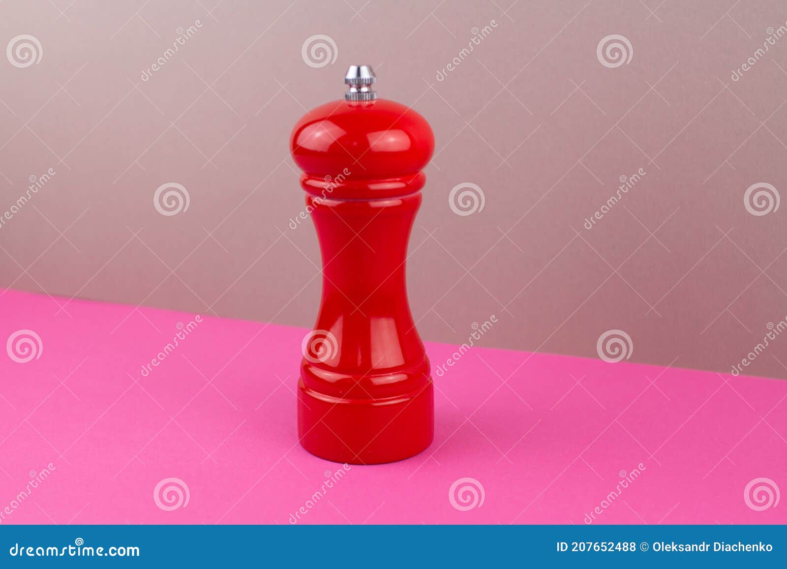 Red Kitchen Pepper Shaker for Ground Pepper on the Table Stock Photo