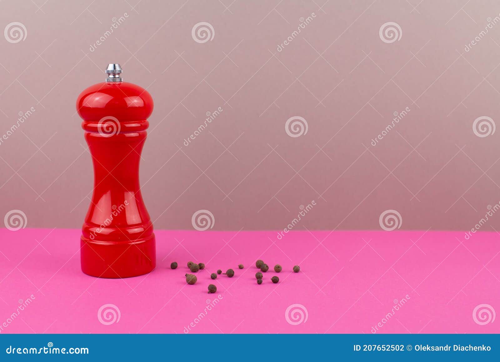 Red Kitchen Pepper Shaker for Ground Pepper on the Table Stock Photo