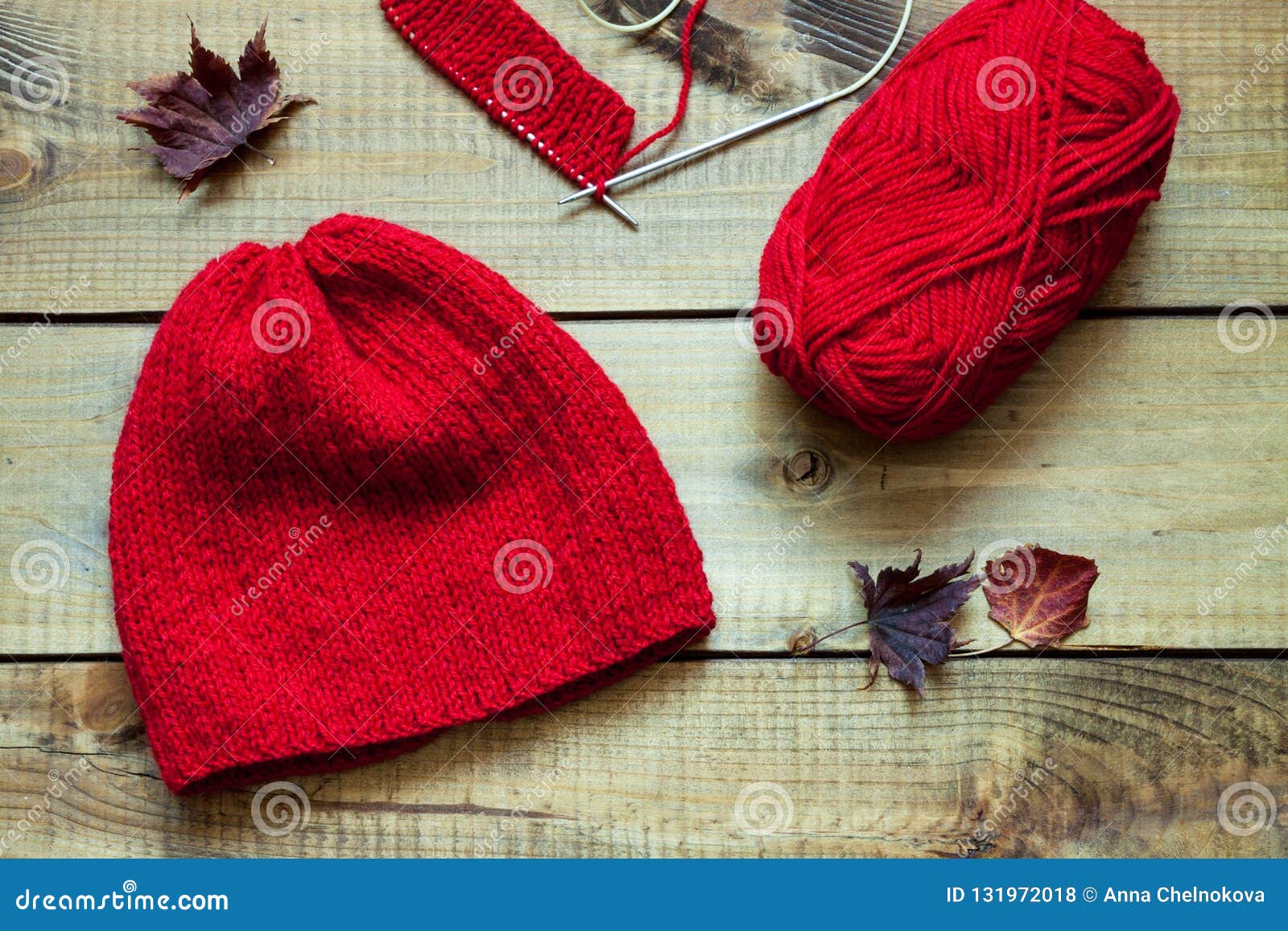 Red Knitting Wool, Knitting Needles and Dried Leaves Stock Photo ...