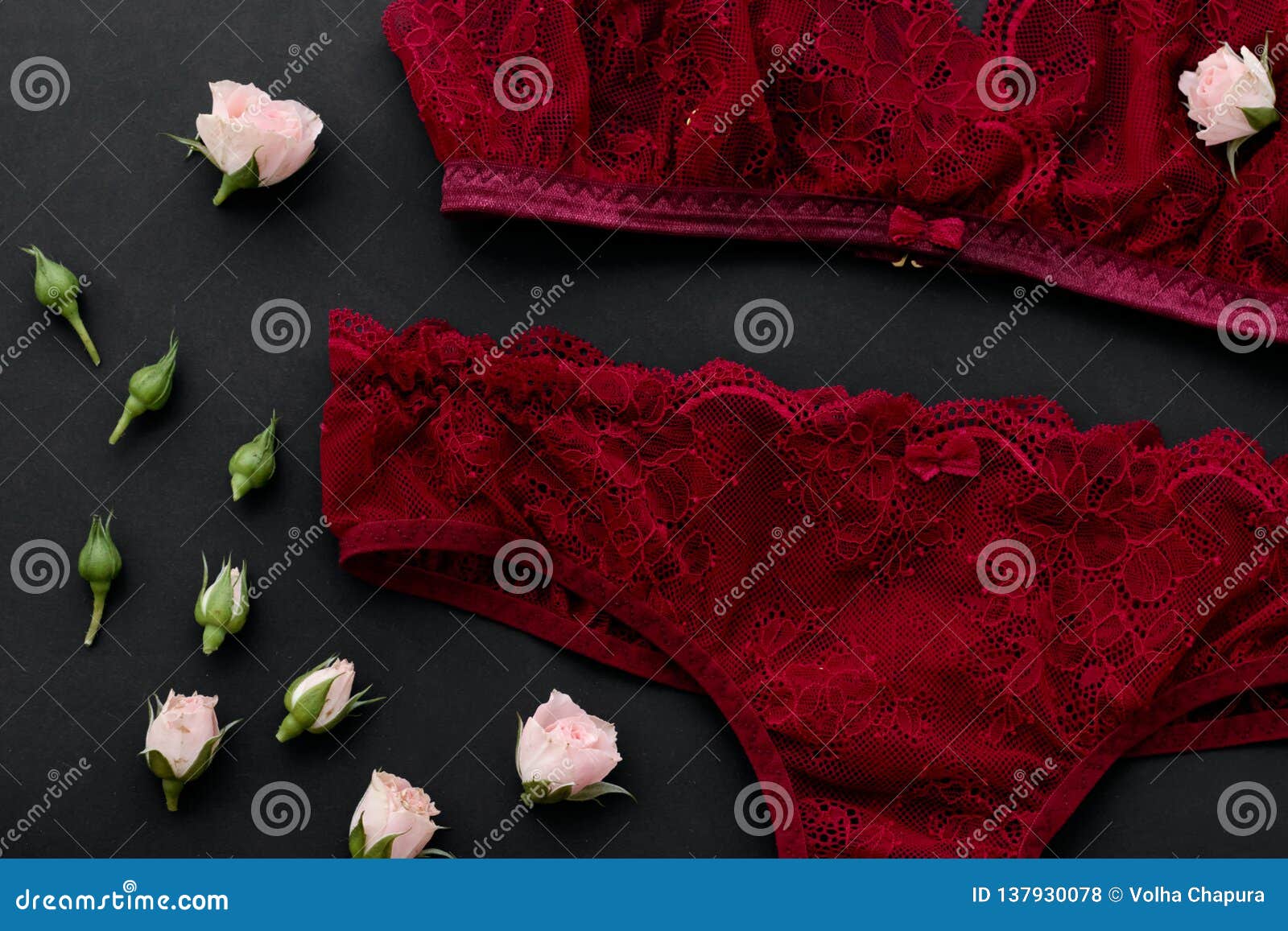 Red lace underwear on black background. Stock Photo