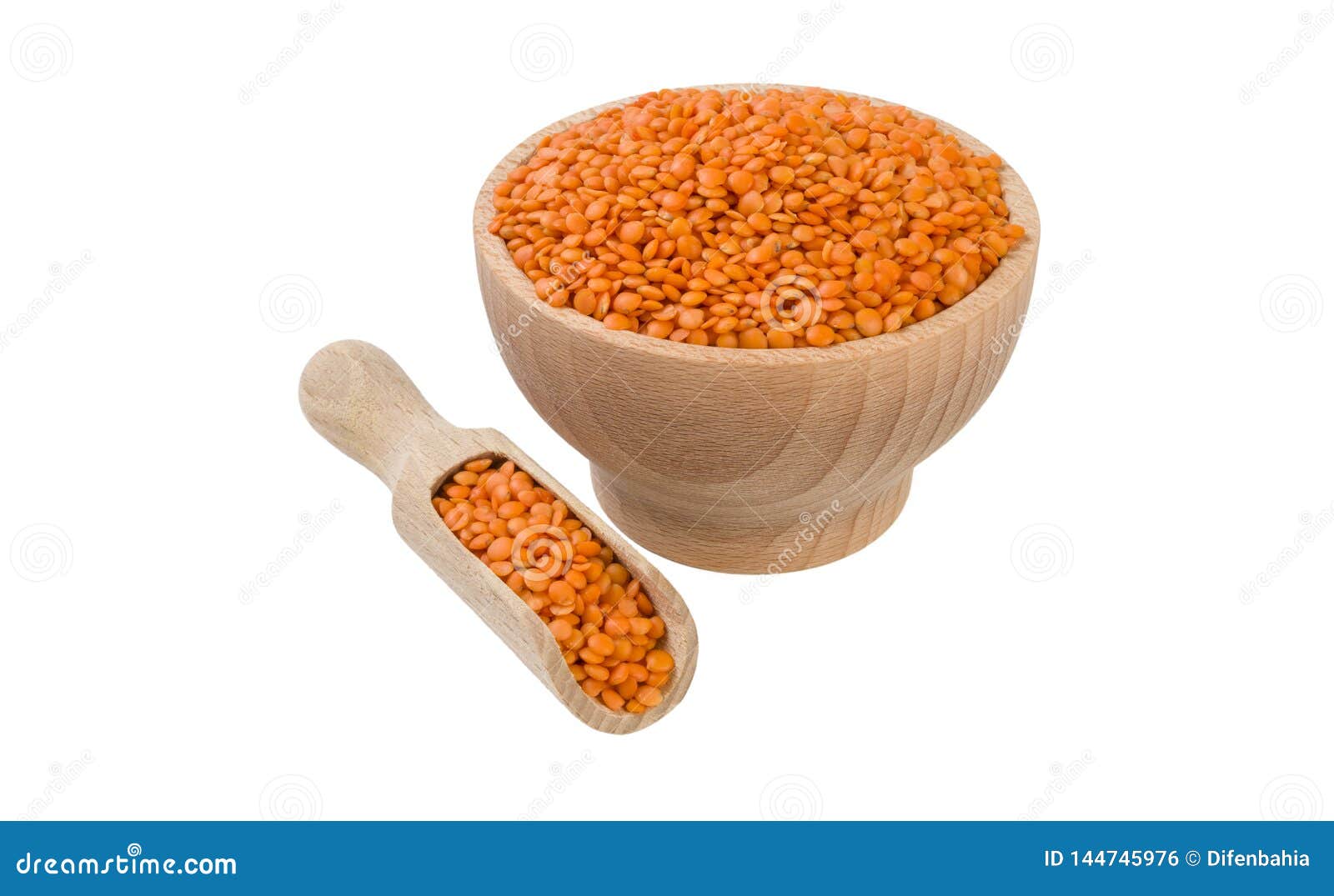 red lentils in wooden bowl and scoop  on white background. nutrition. bio. natural food ingredient