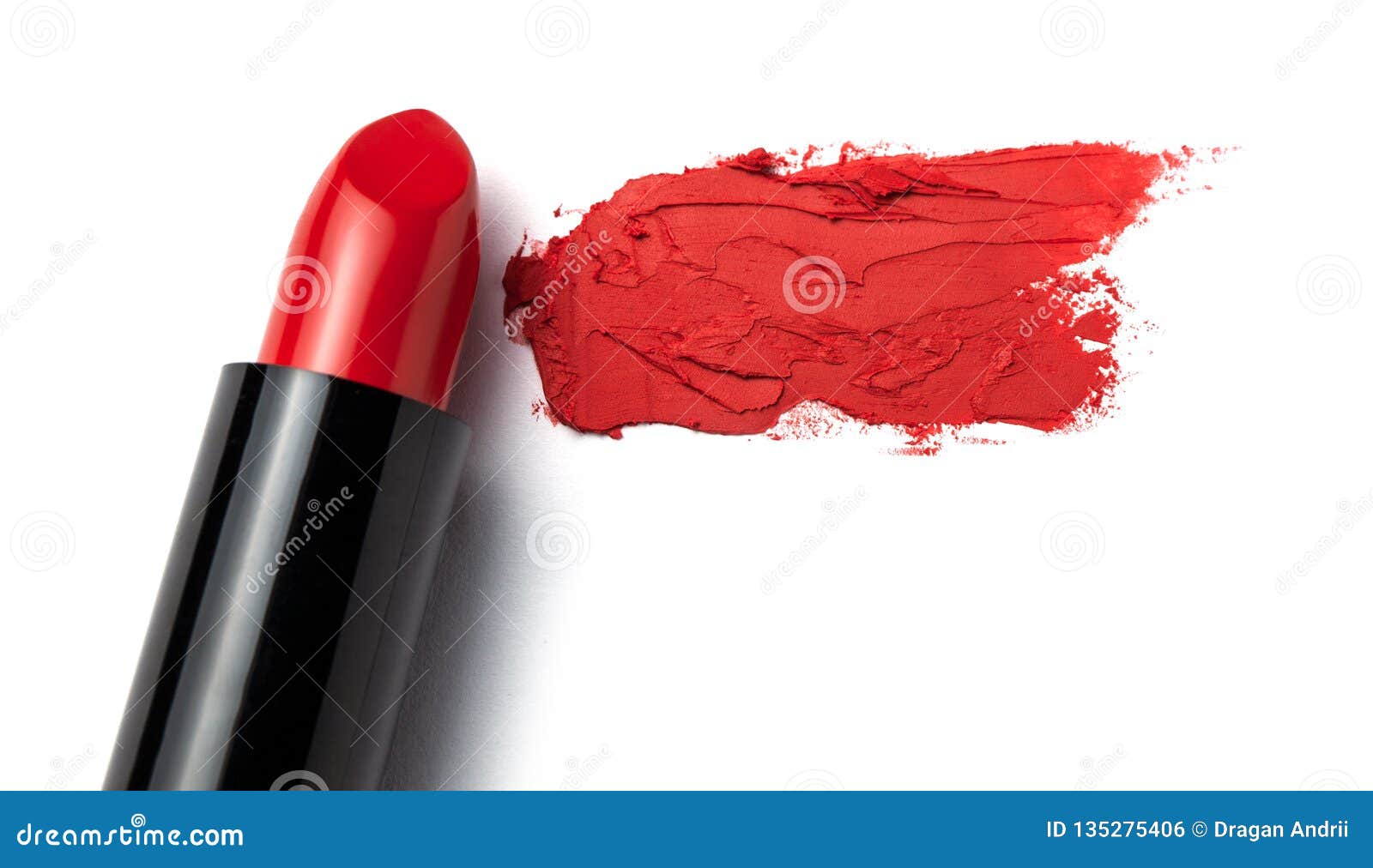 Red Lipstick Bullet Smudged on White . Copy Space for Text. Stock Photo