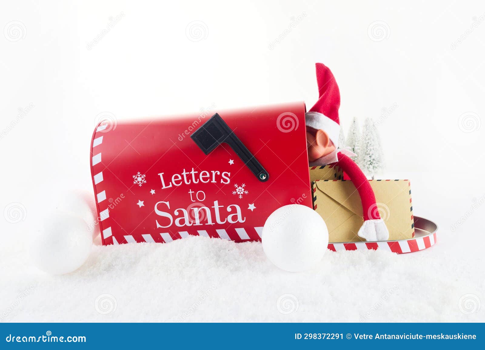 red mailbox for christmas mailings with letters to santa claus and elf.