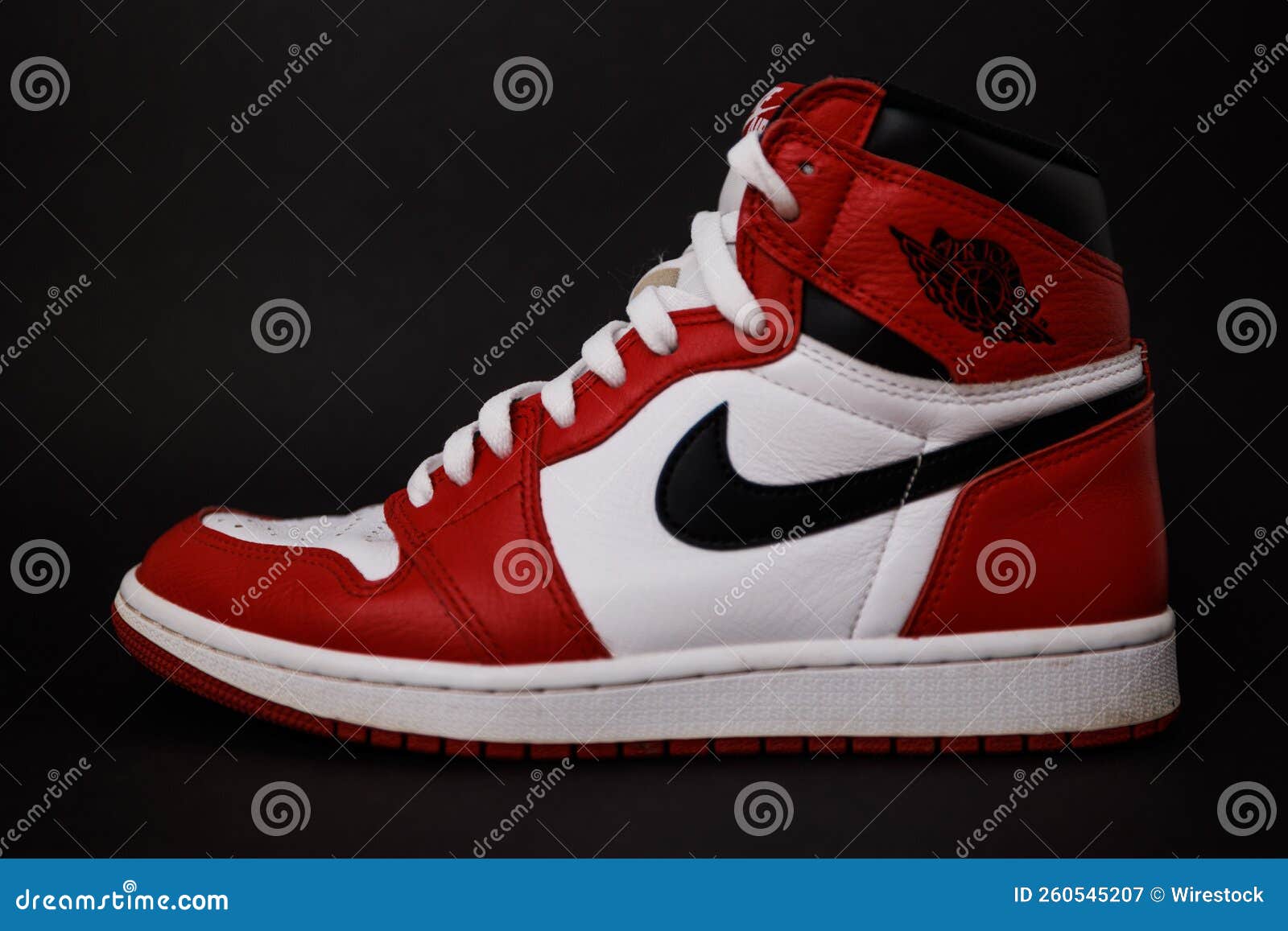 Red Nike Air Jordan I Shoe with Black Background Editorial Photography