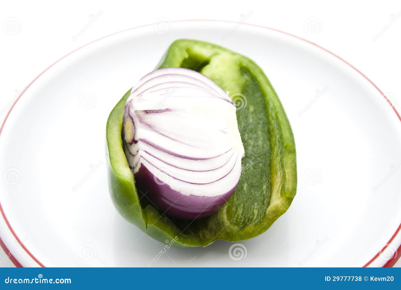 Red Onion in Green Bell Pepper Stock Photo Image of plastic, pepper 29777738