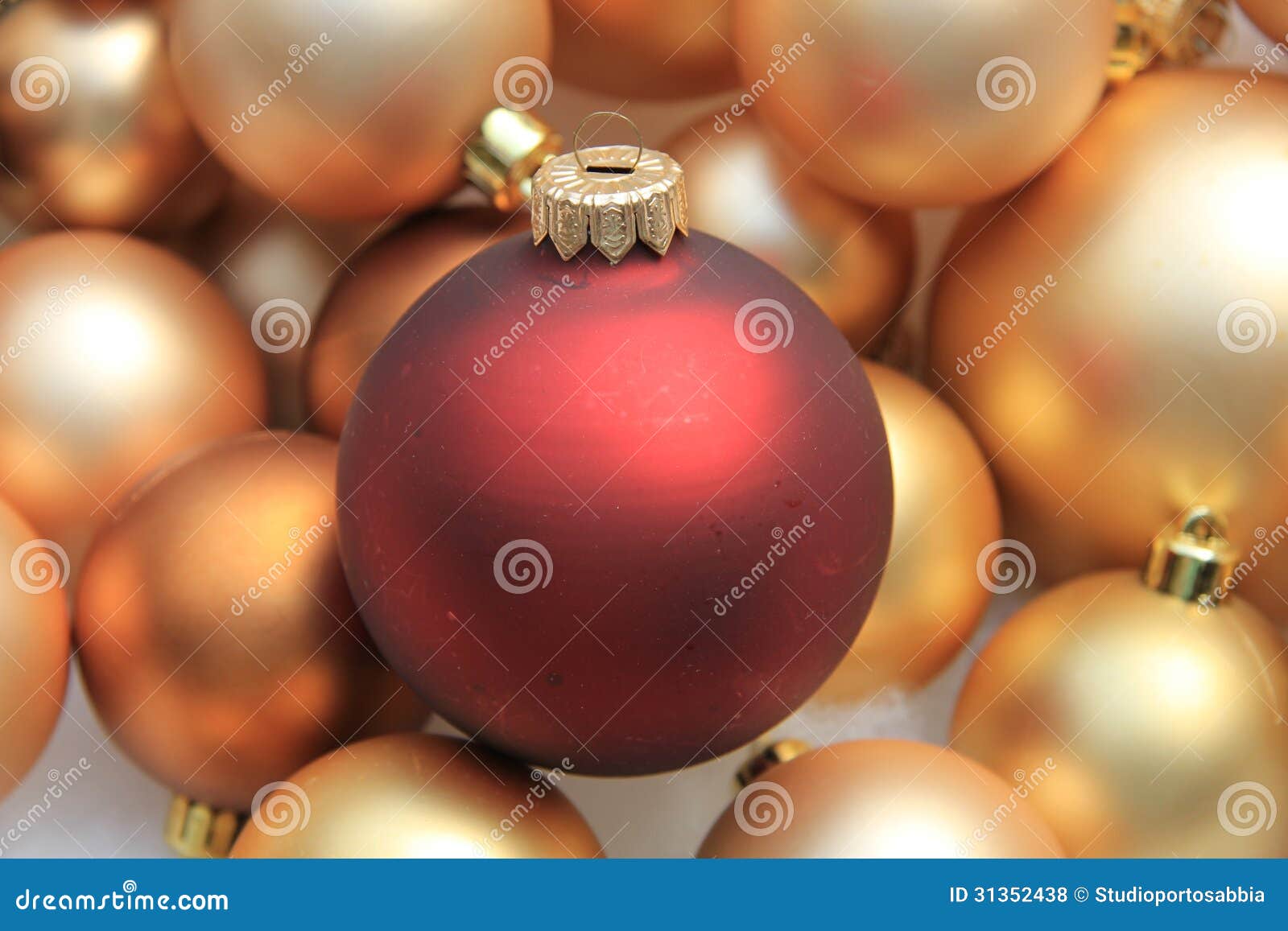 Red Ornament on a Pile of Golden Ornaments Stock Photo - Image of ...