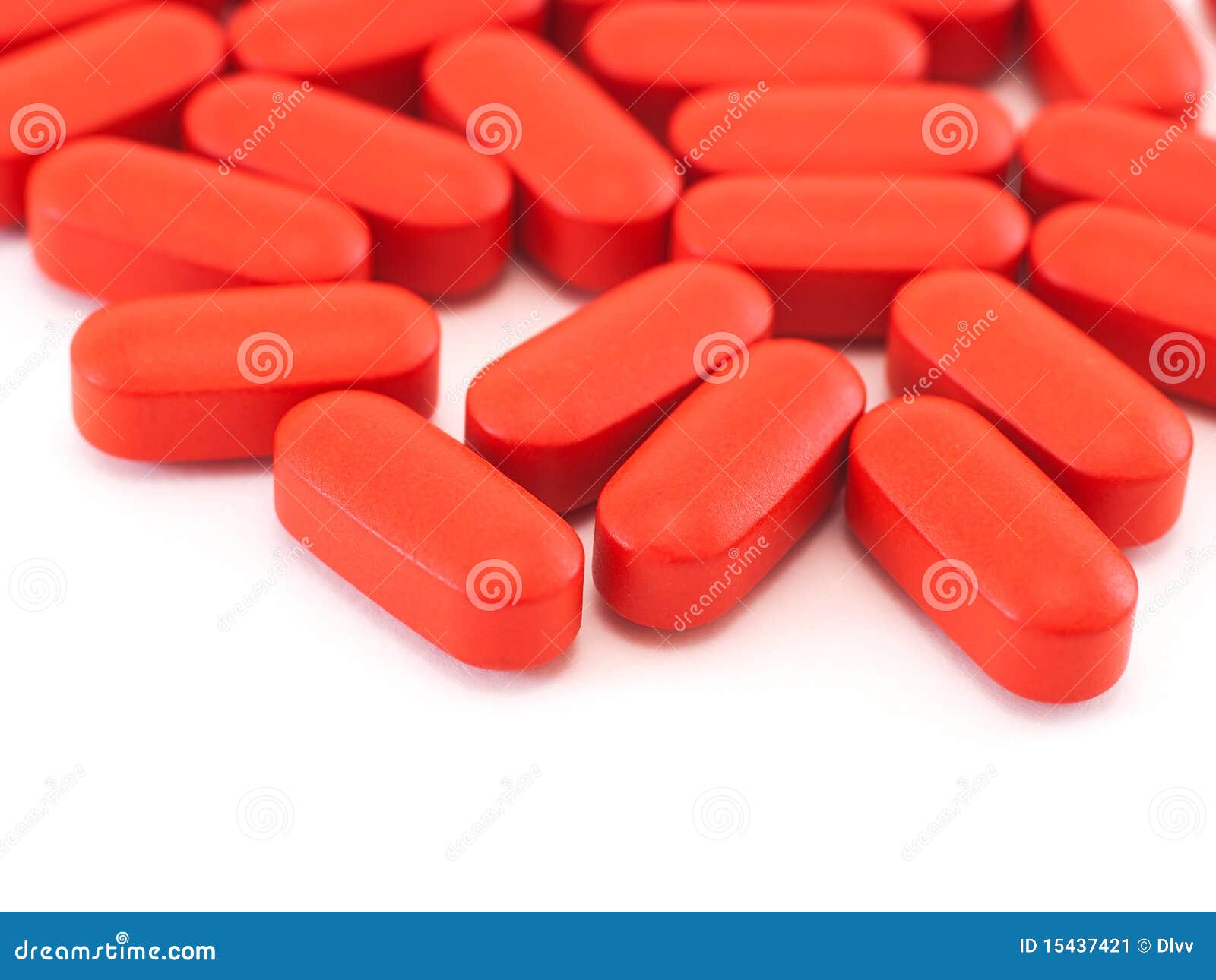 Red oval pills on white stock image. Image of pharmacy 15437421