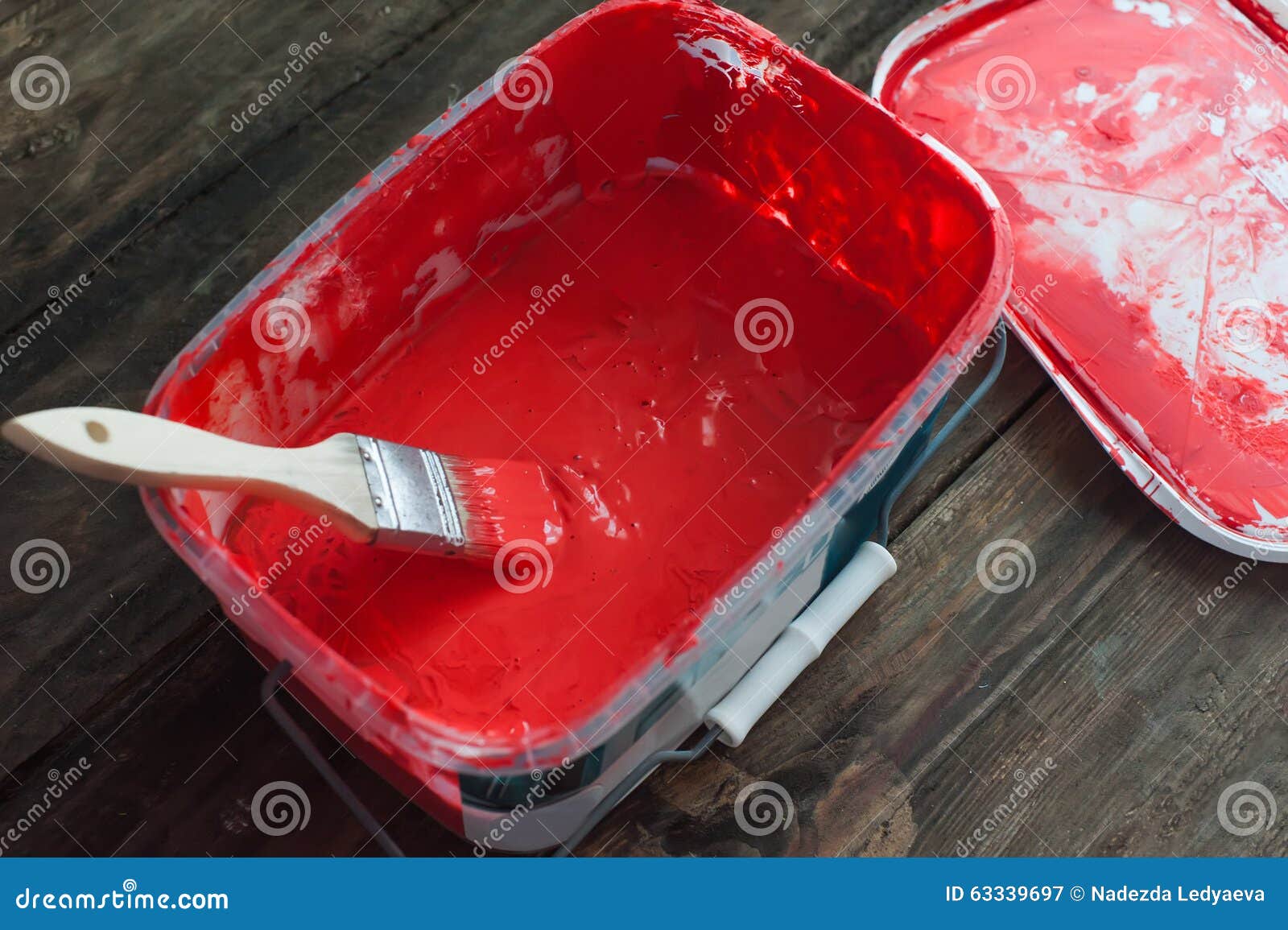 Red paint in a bucket stock image. Image of floor, decorating 63339697