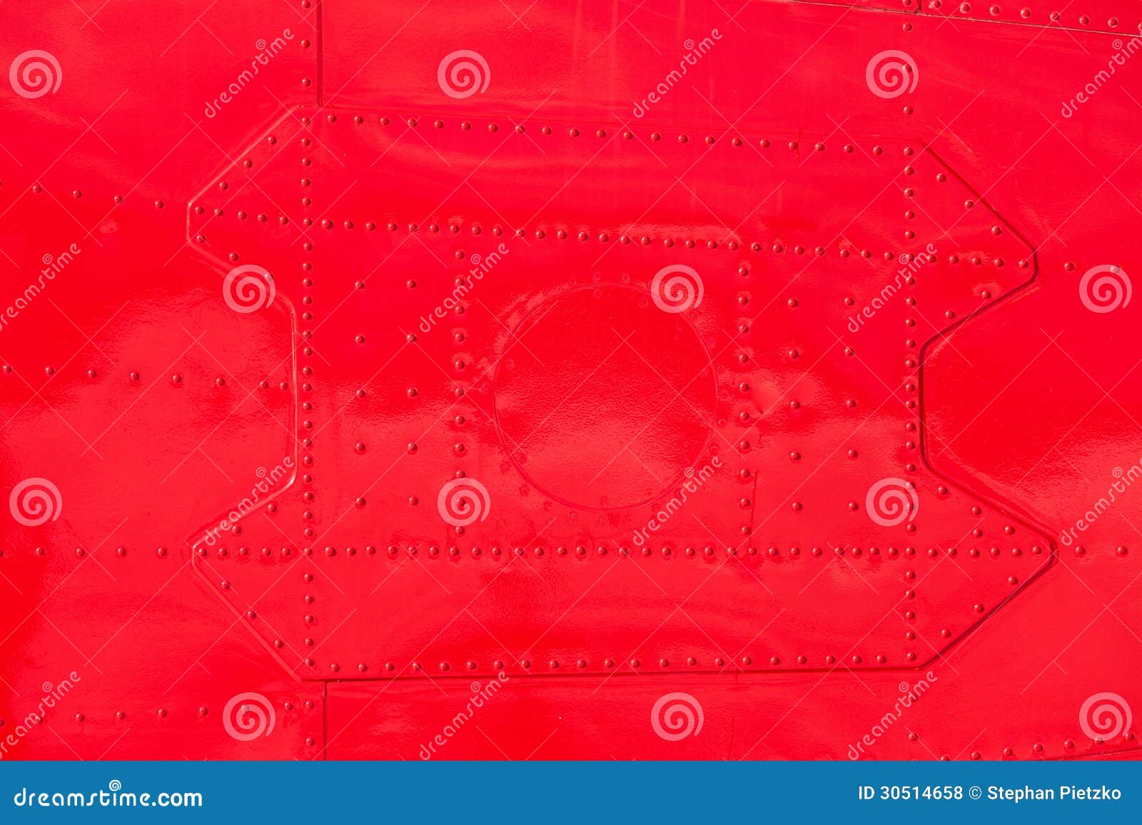 red painted riveted metal airplane fuselage skin