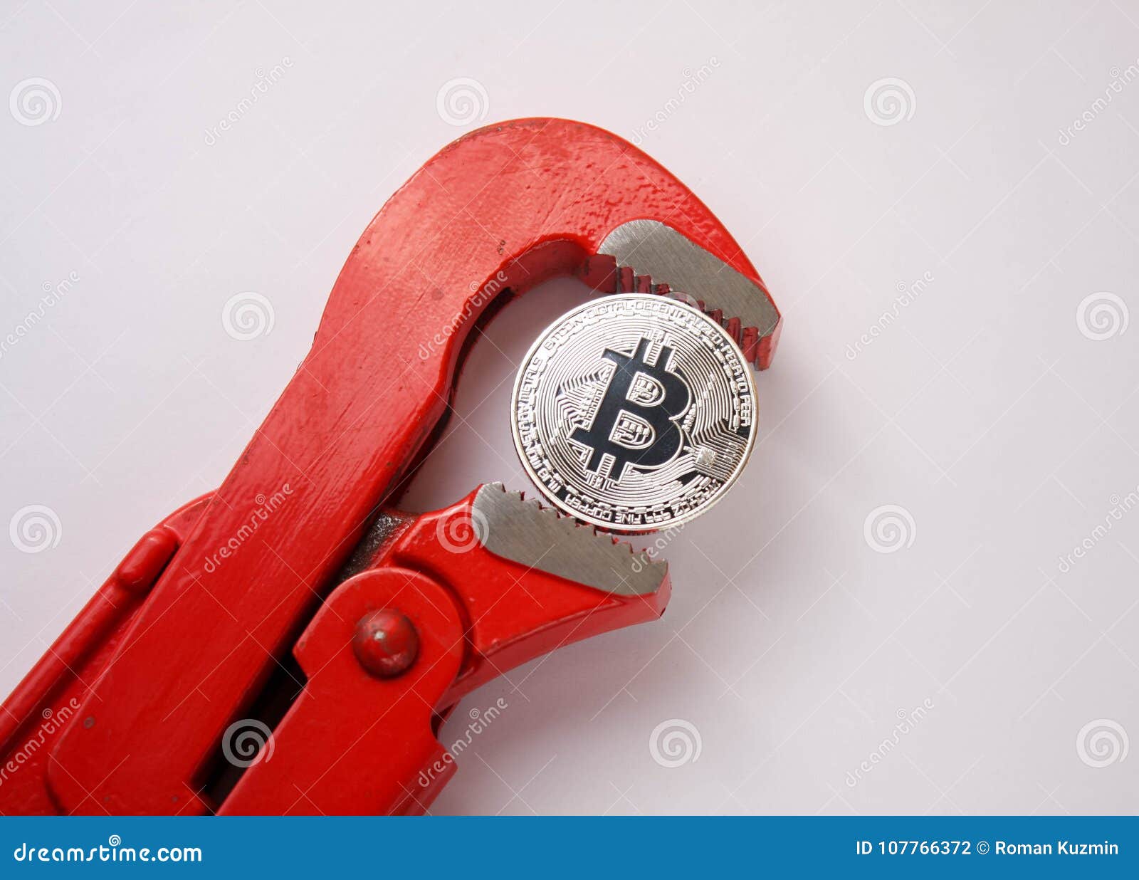 Red Pipe Spanner Clamps a Silver Coin Bitcoin Stock Photo - Image of spanner,  mining: 107766372