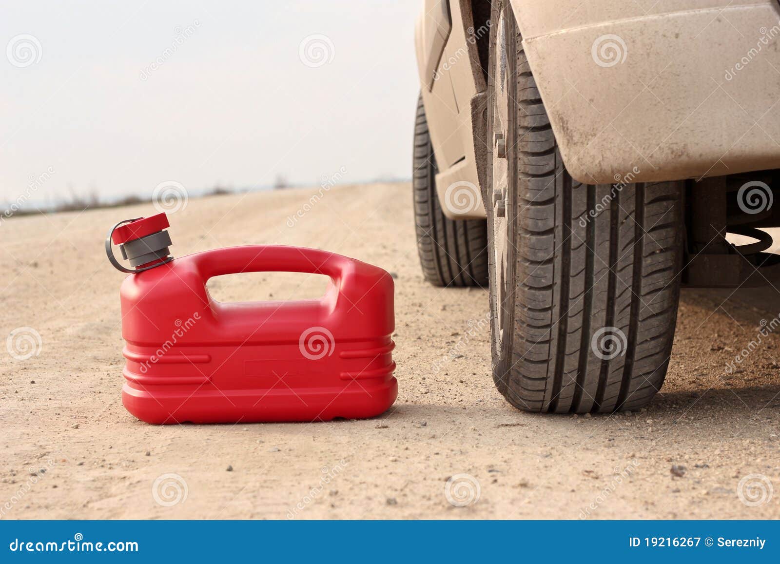Red Plastic Fuel Canister on Dirt Road with Car Stock Image Image of