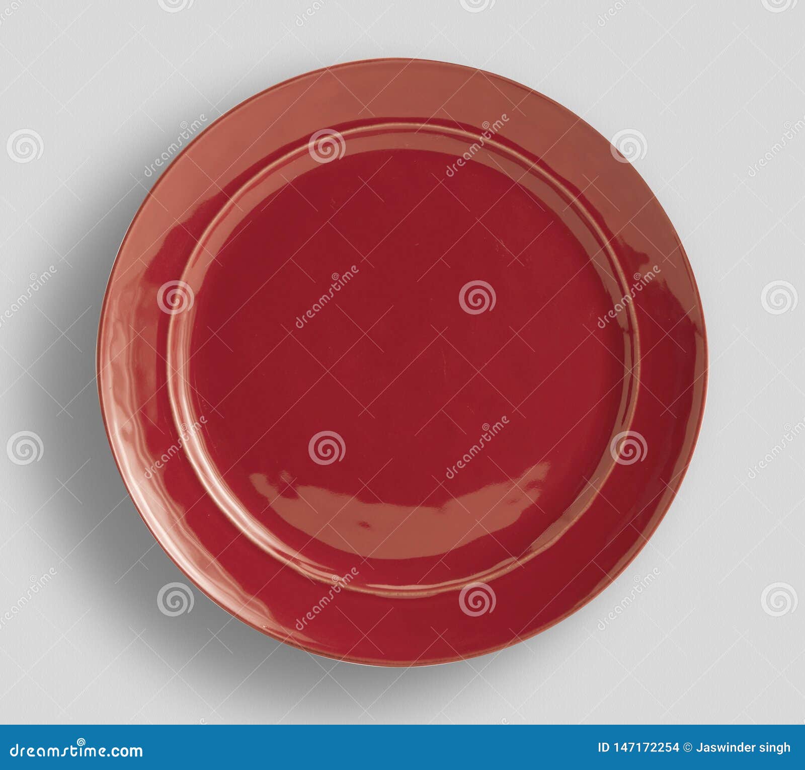 red plate on white background - image