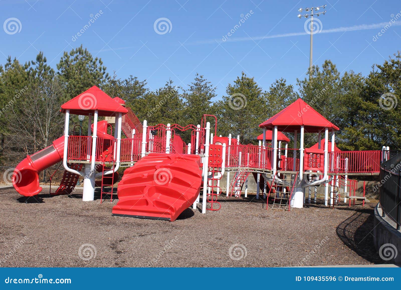 red playgroud outdoors and blue sky