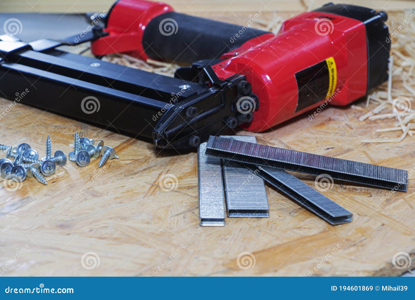 Red Pneumatic Construction Stapler and a Stack of Staples for the Stapler Stock Image Image of