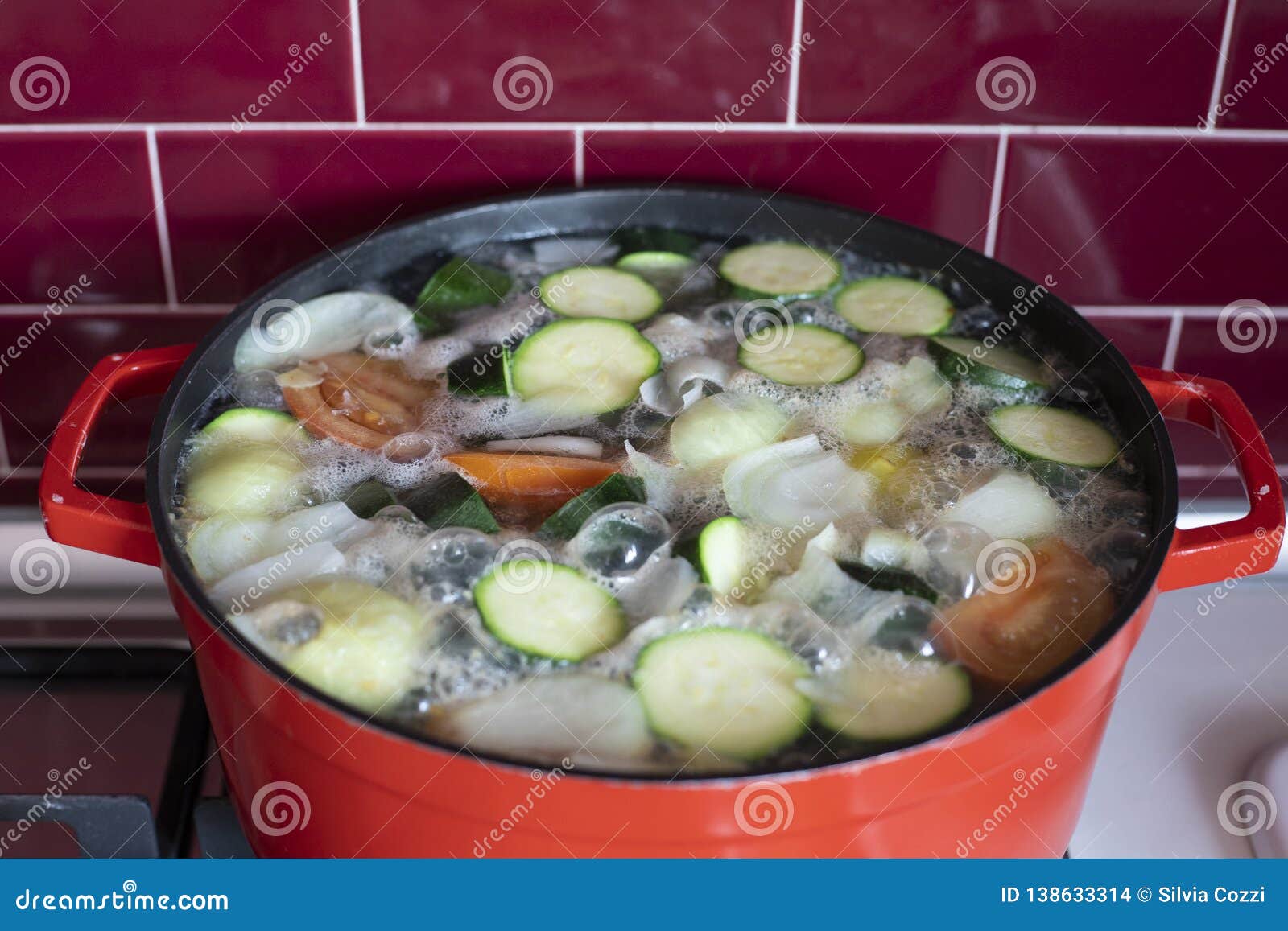 Red pot with boiling soup stock photo. Image of greenery 138633314