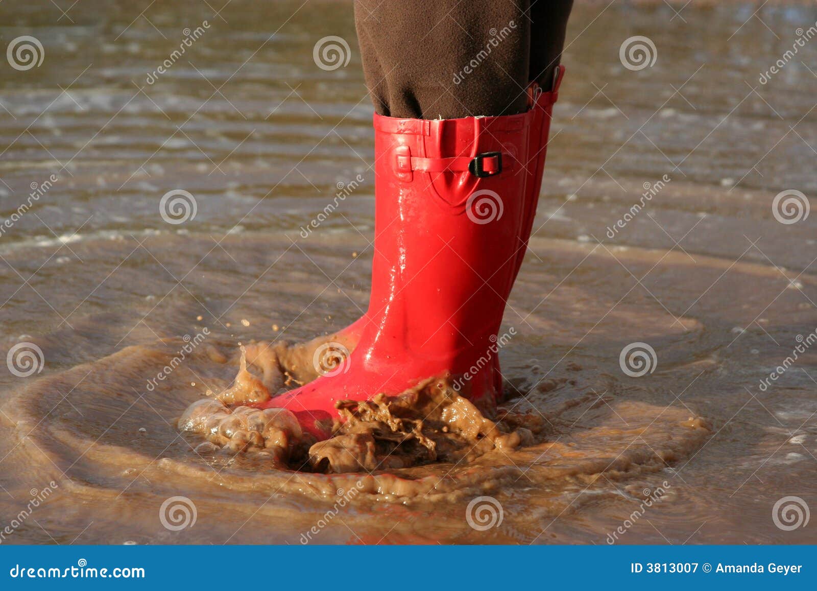 Red Rain Boots In Puddle Royalty Free Stock Photography - Image: 3813007