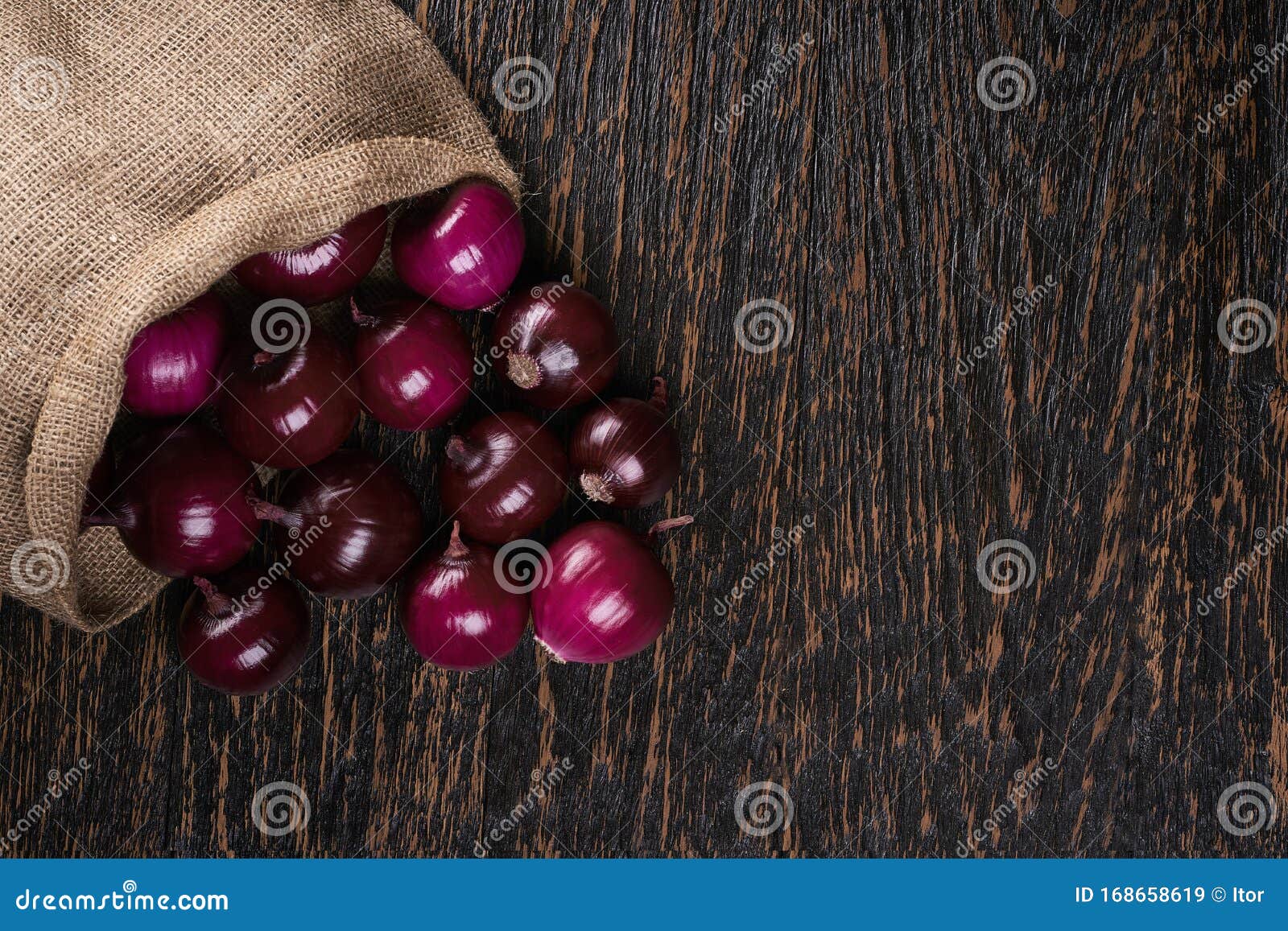 Premium Photo  Fresh red onions in bag on wooden