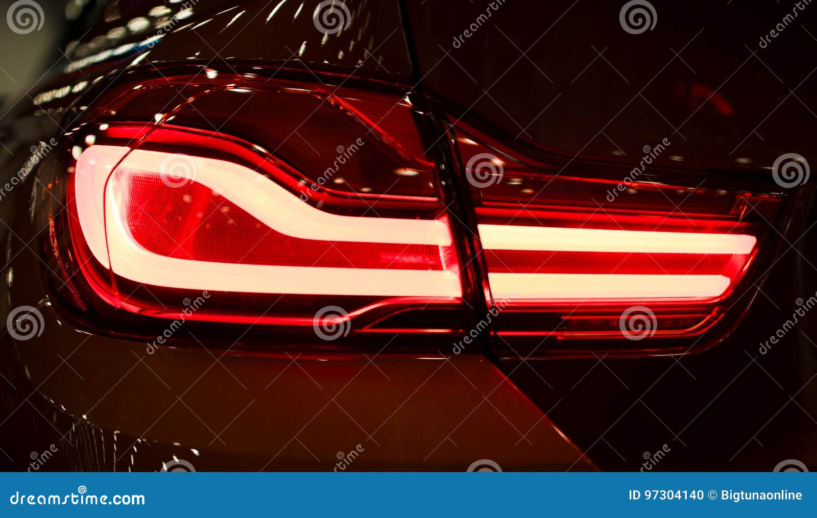 Red Rear Light On A Modern Car With Reflection  The