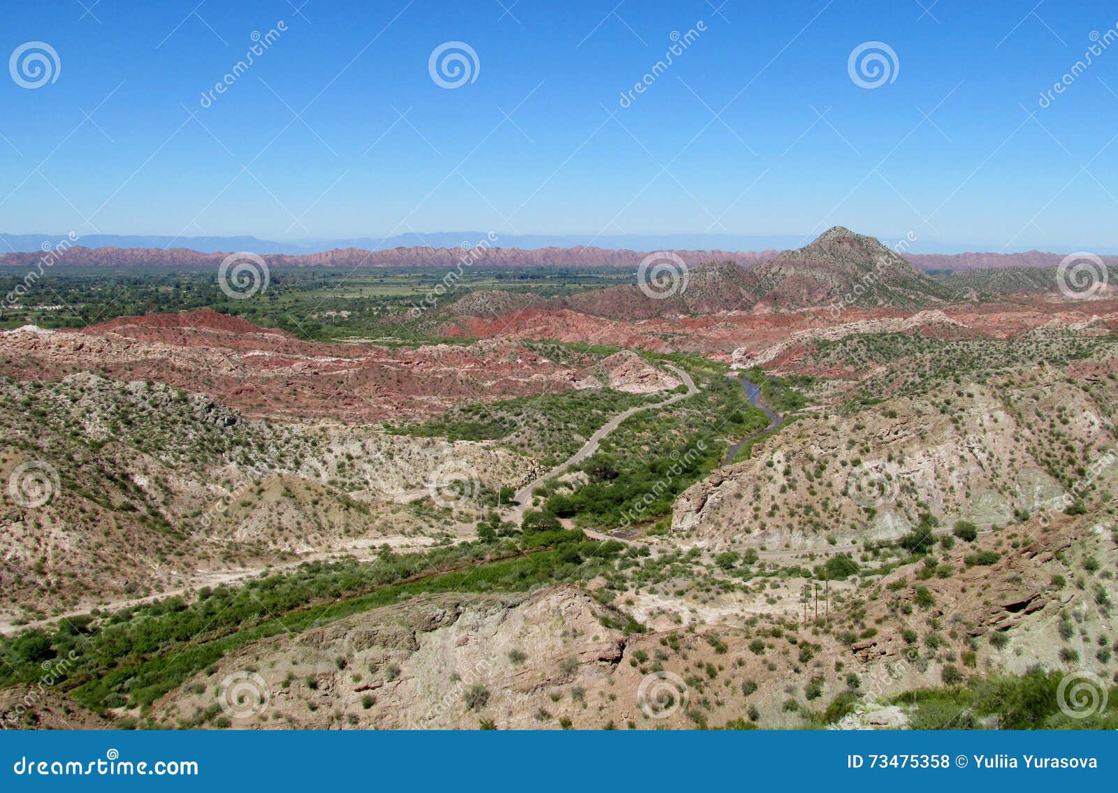 red rocks and green valley mountain landscape