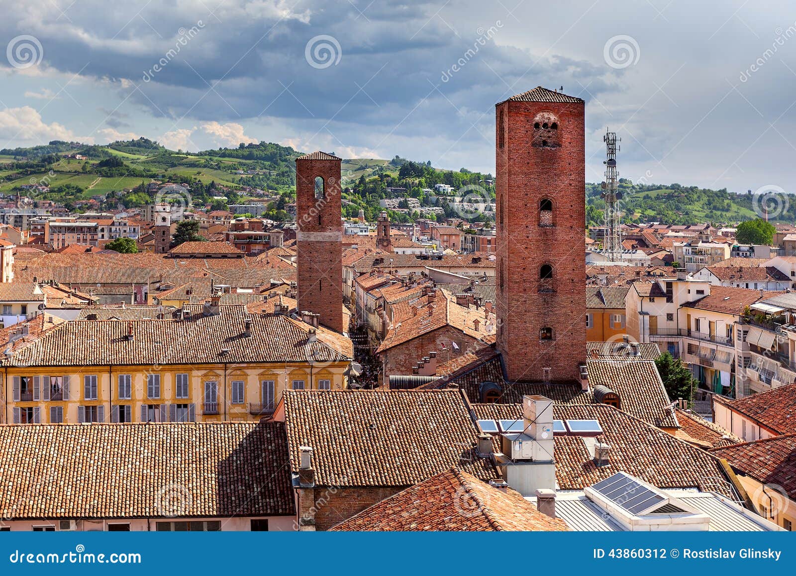 red roofs and medieval towers of alba, italy.